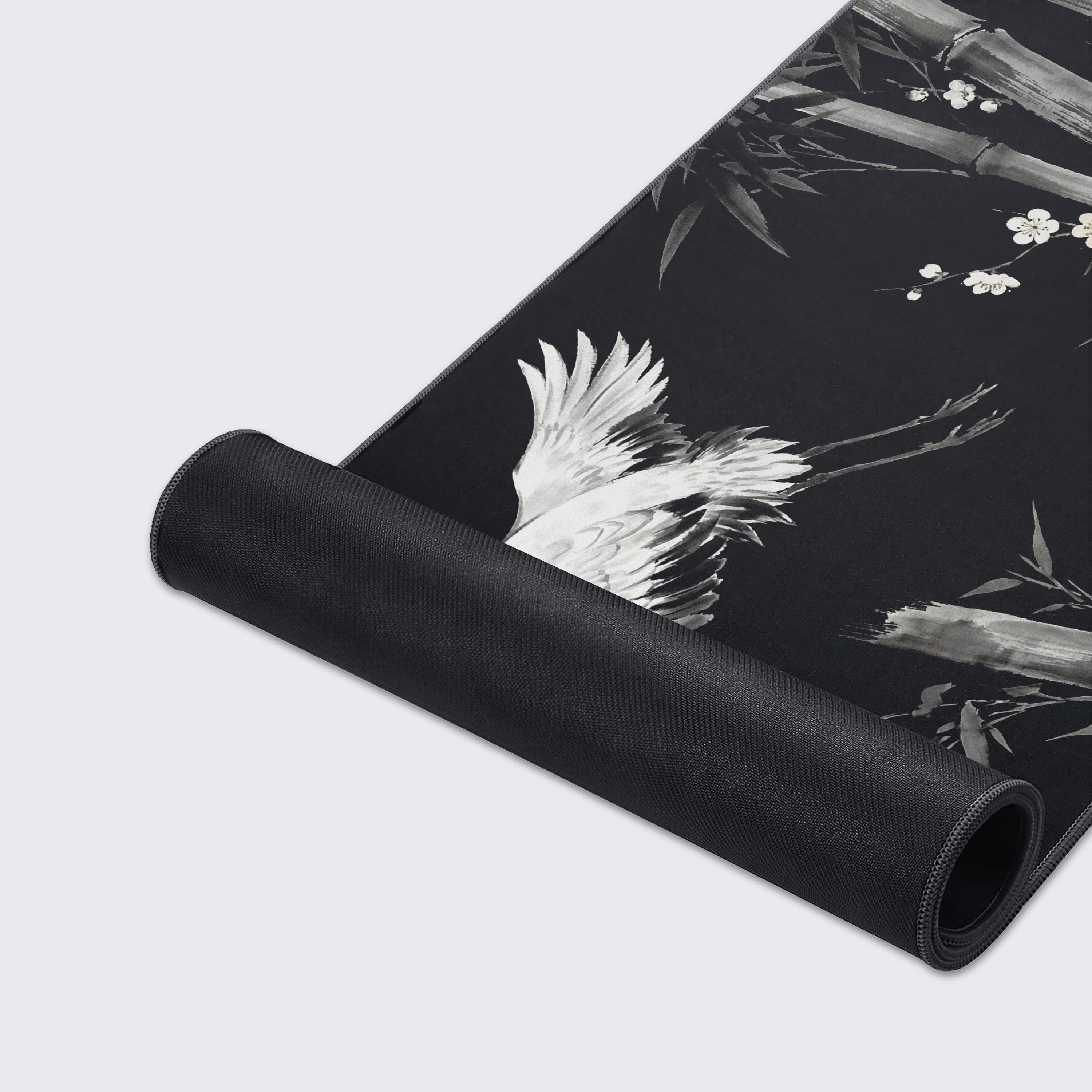 Close-up of the Shadow Flight gaming desk mat, highlighting the detailed ink wash crane design, smooth fabric texture, and durable stitched edges for peak performance. - Epic Design Pads & Mousepads