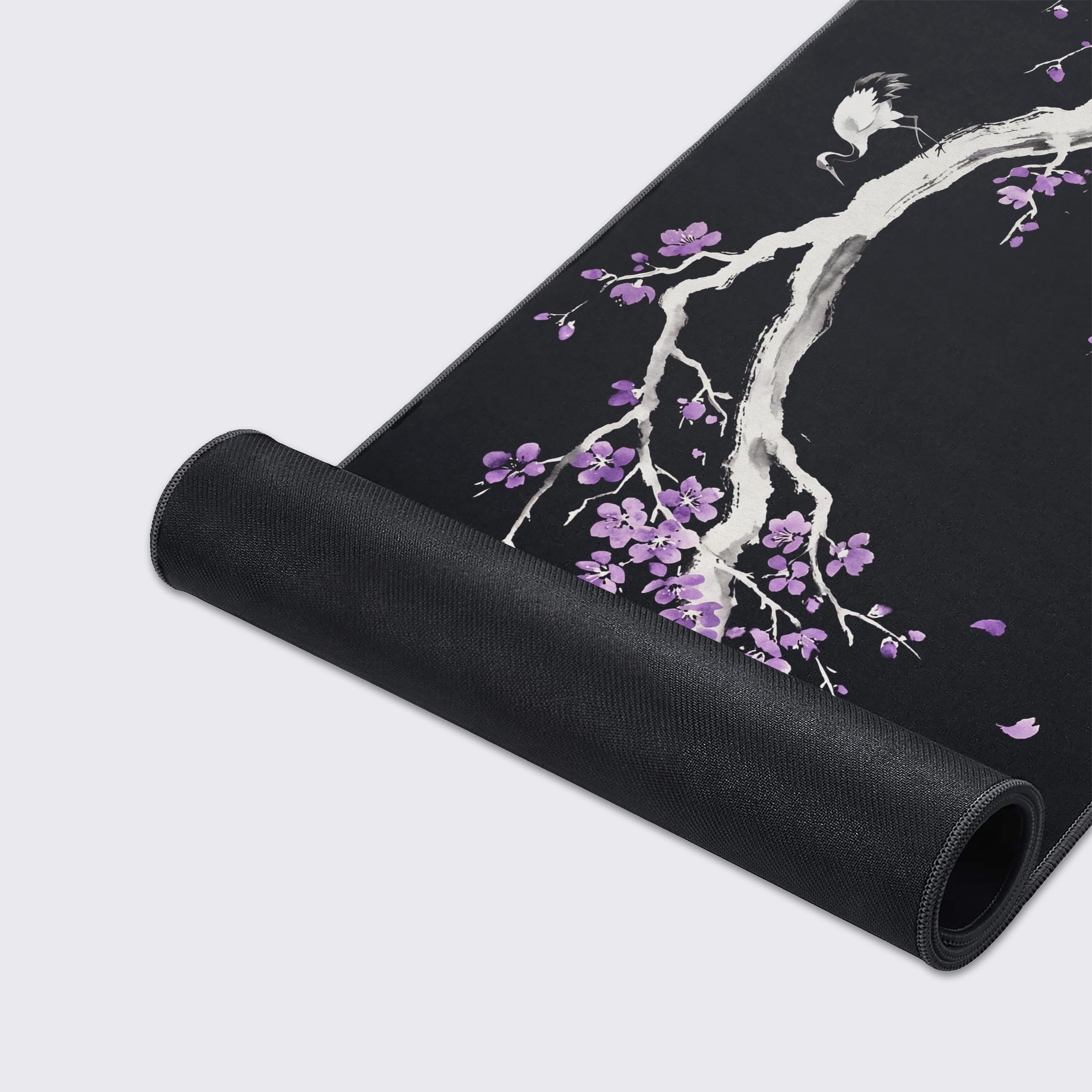 Close-up of the Royal Sakura mouse pad's high-quality fabric texture and stitched edges, showcasing the detailed purple blossom and ink wash art. - Epic Design Pads & Mousepads