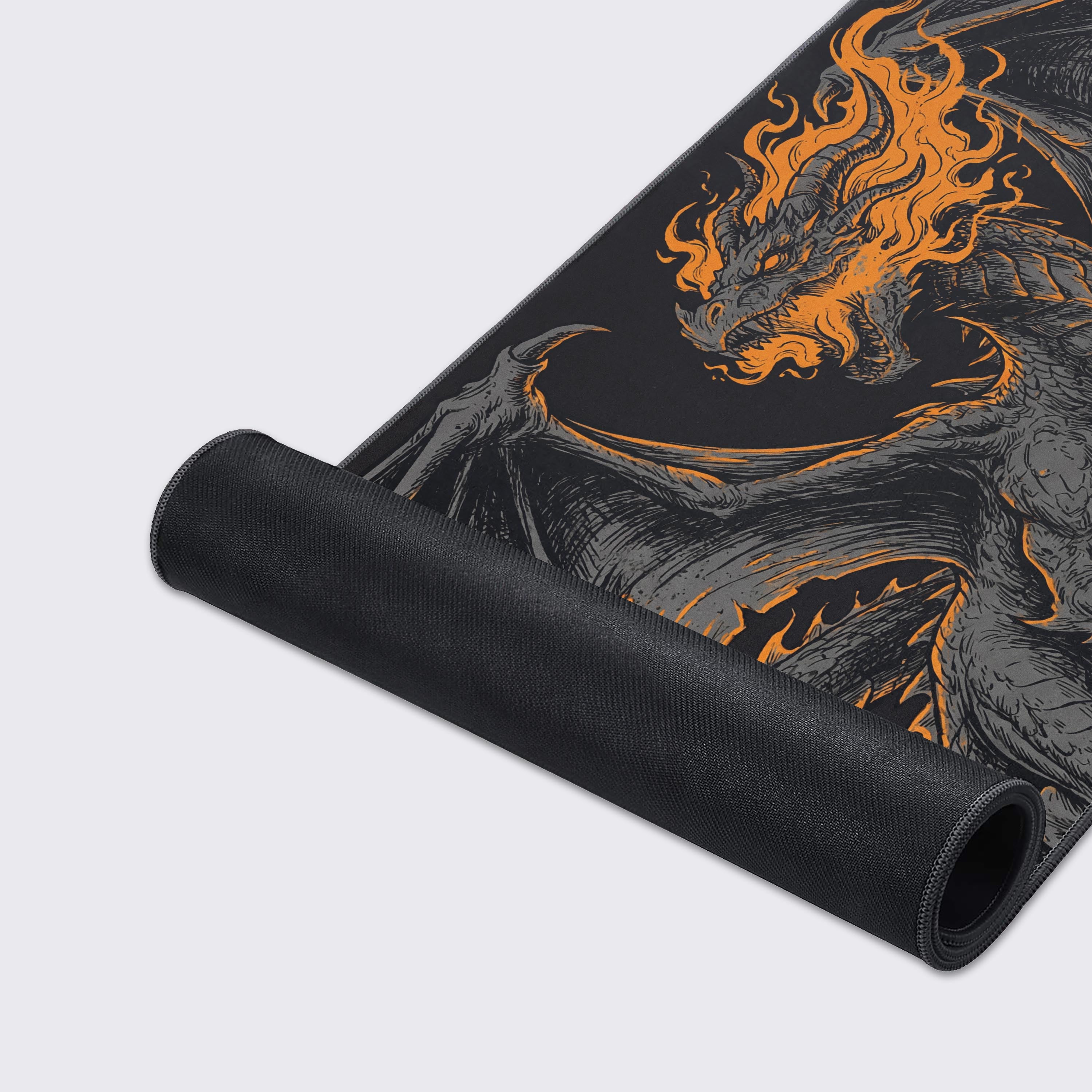 A close-up of the Ember Beast gaming desk mat, highlighting the high-quality texture, stitched edges, and detailed orange and black dragon artwork. - Epic Design Pads & Mousepads