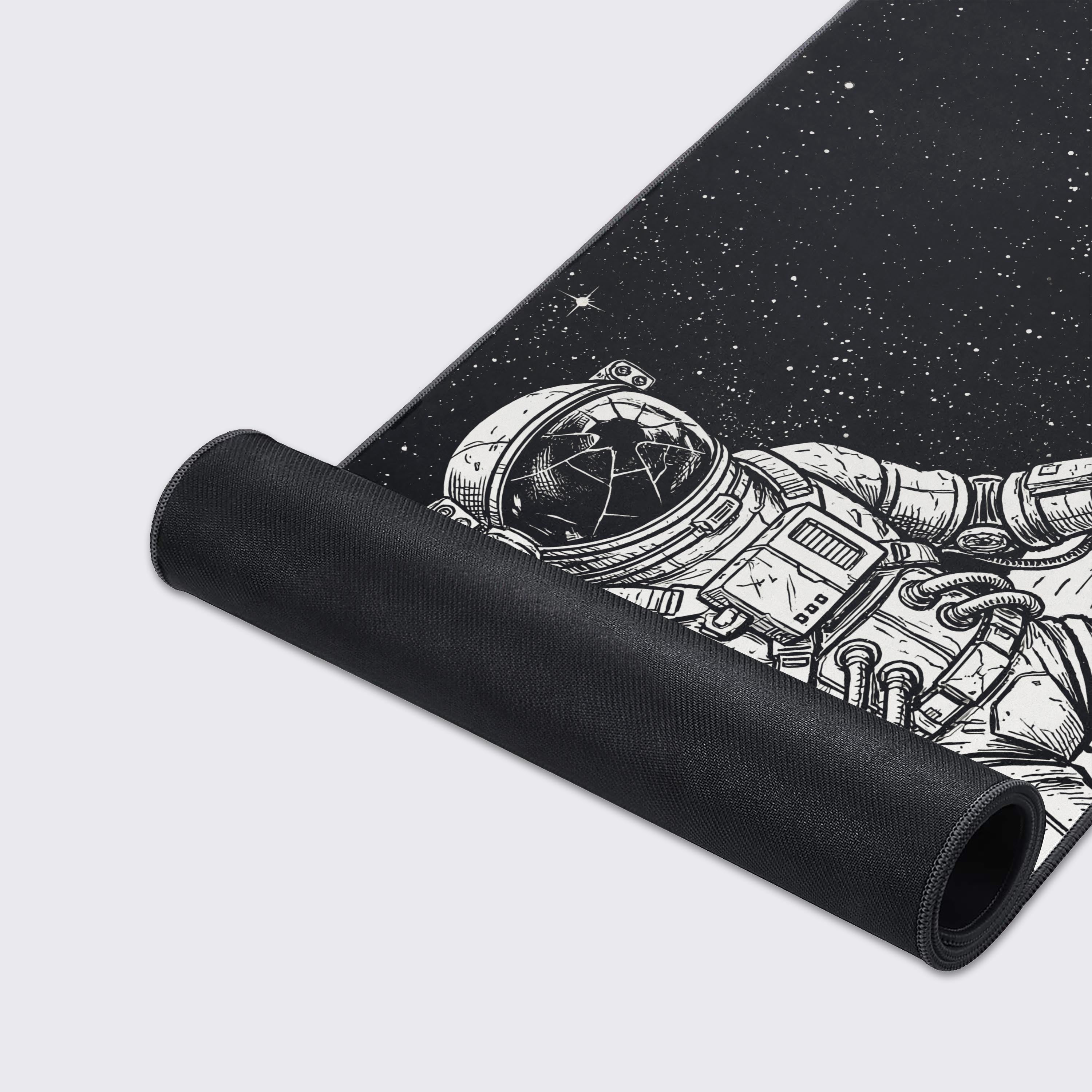 A close-up of the Shattered Void gaming desk mat showcases its high-quality stitched edges and smooth fabric texture, featuring the detailed astronaut line art. - Epic Design Pads & Mousepads