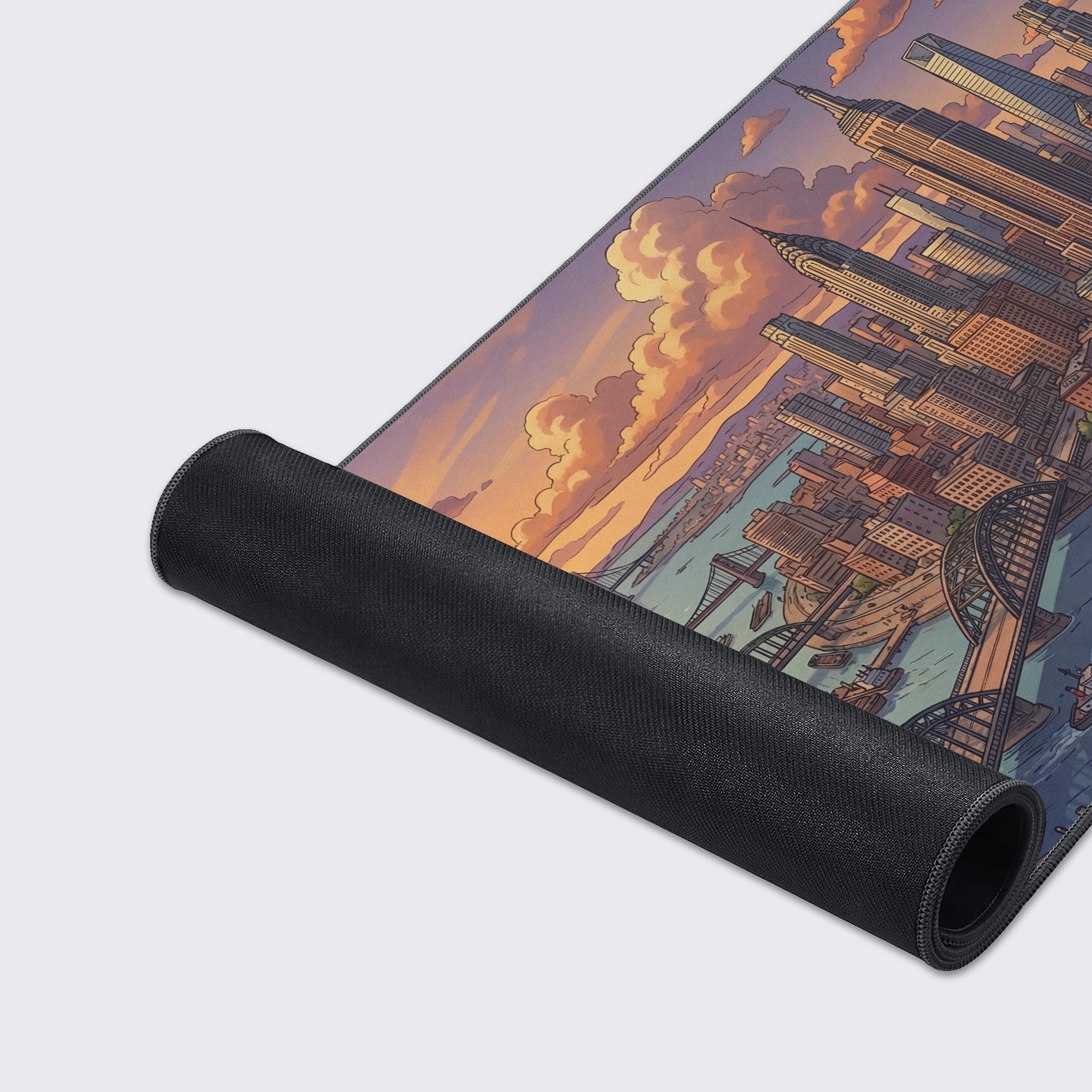 A close-up of the Sunset Commerce desk mat, highlighting the high-quality fabric texture and durable stitched edges of the urban landscape design. - Epic Design Pads & Mousepads