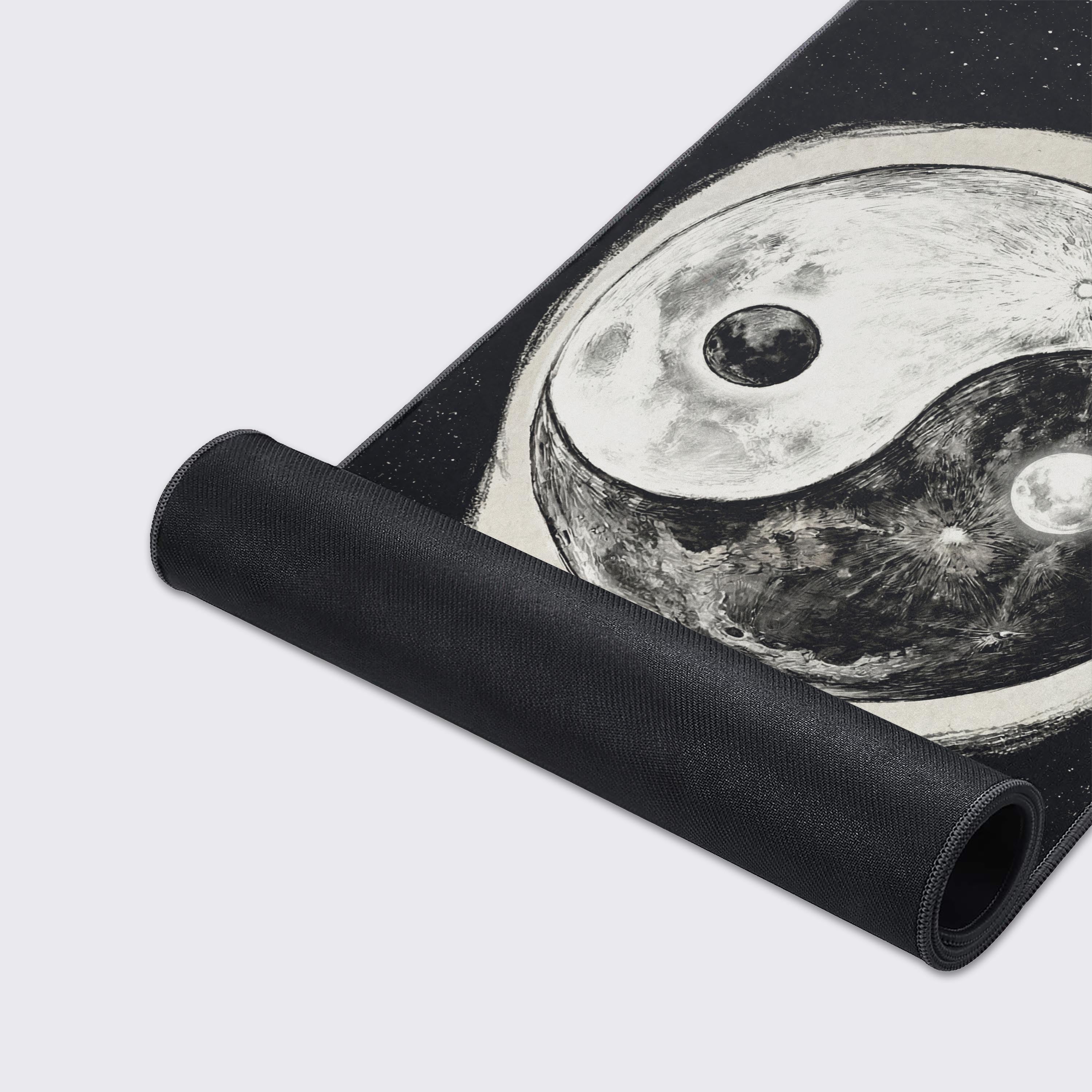 Close-up of the Cosmic Yin Yang gaming desk mat's smooth fabric texture and durable stitched edges, highlighting the detailed cratered moon artwork. - Epic Design Pads & Mousepads