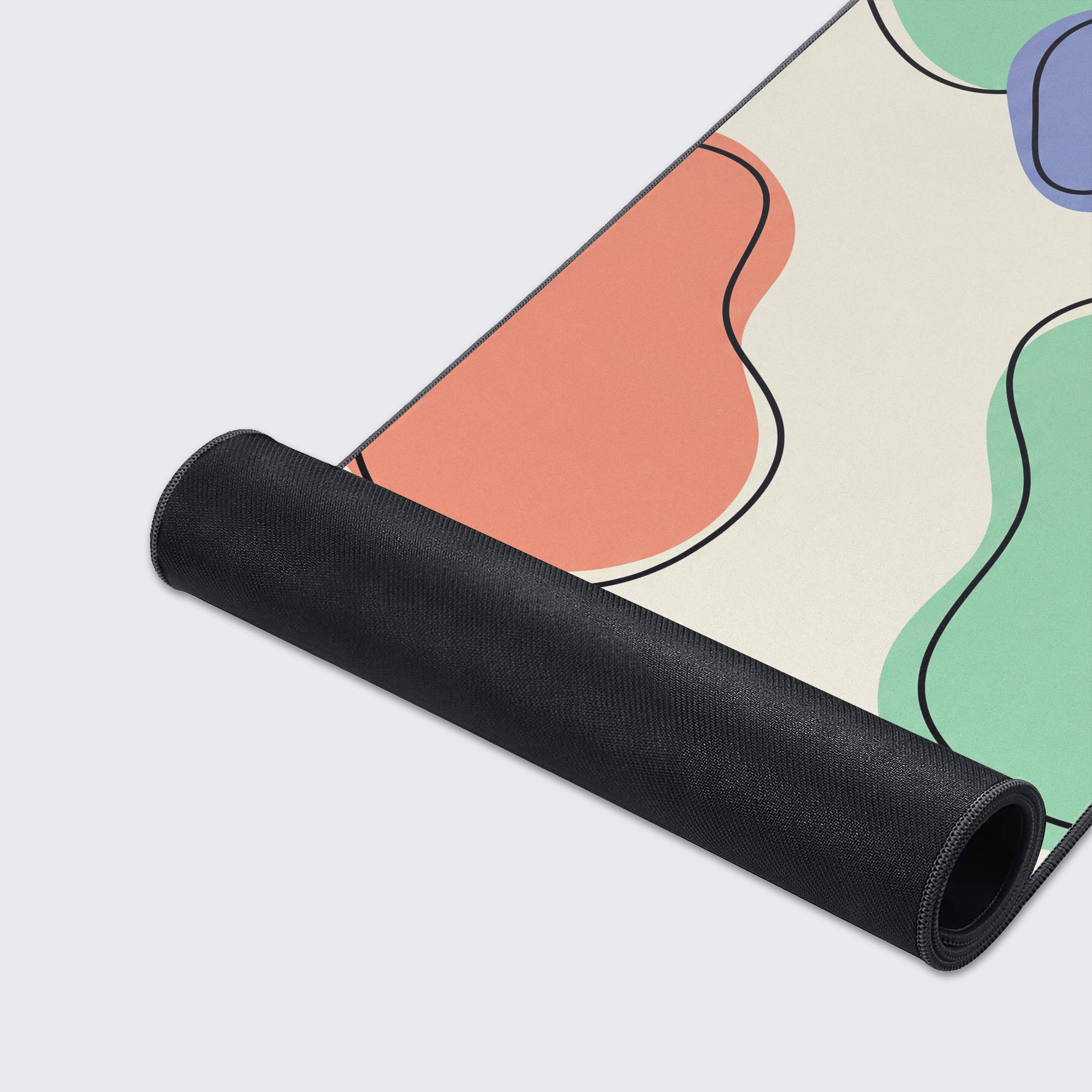 Close-up of the smooth fabric and stitched edges of the Organic Convergence Mouse Pad, highlighting its quality and colorful, fluid abstract pattern. - Epic Design Pads & Mousepads