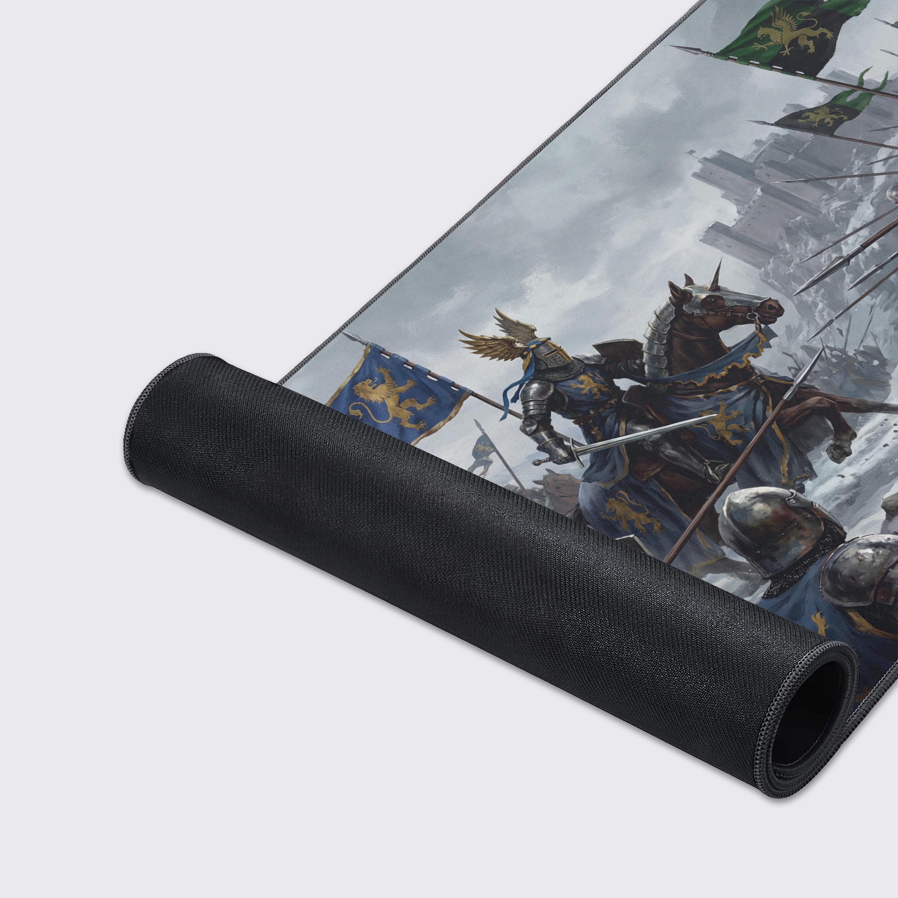 A detailed close-up of the Winter Siege gaming desk mat showcasing its smooth fabric texture and anti-fray stitched edges, with detailed artwork of knights in armor. - Epic Design Pads & Mousepads