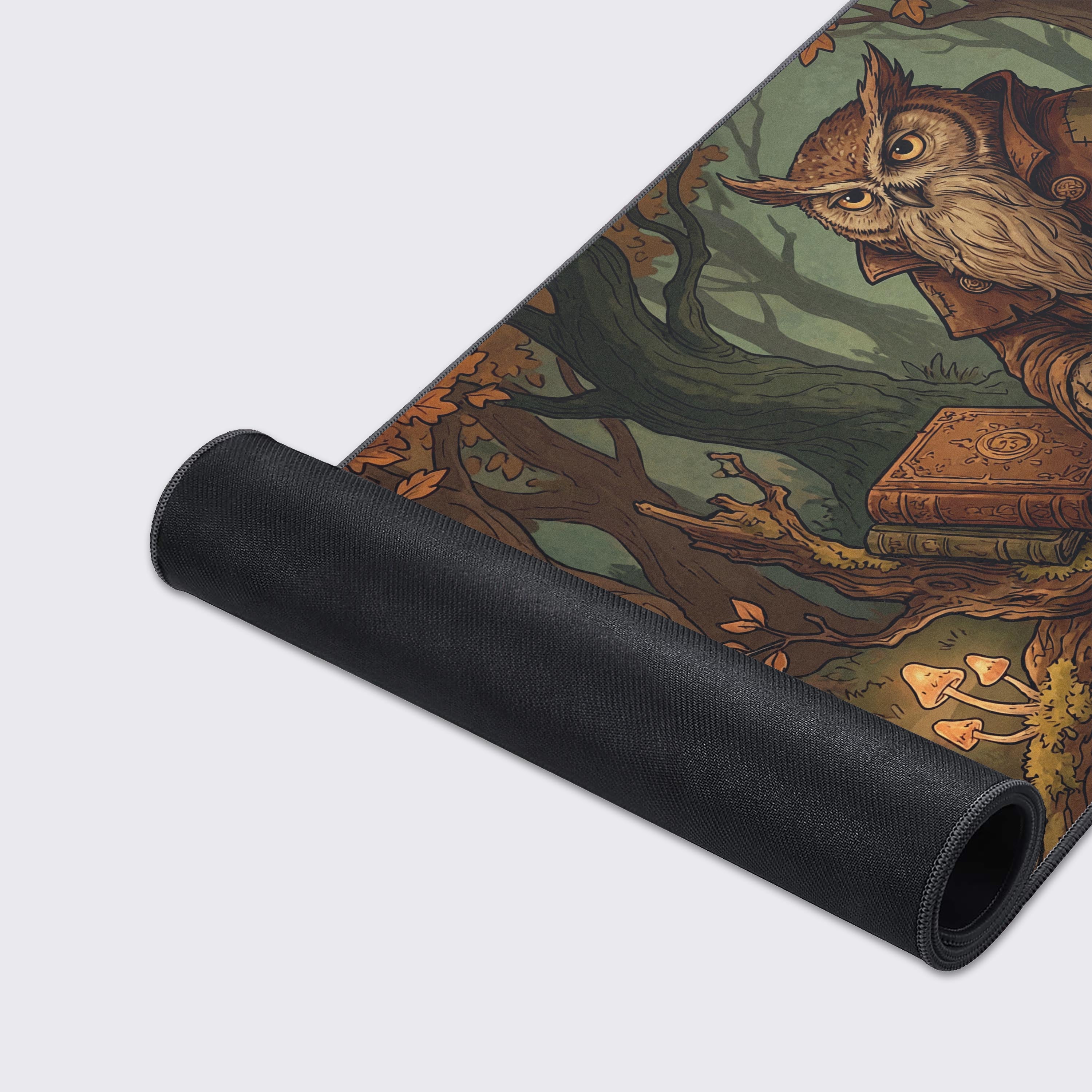 A close-up of the Ancient Owl Scholar Gaming Desk Mat showing the detailed artwork of the wise owl and the durable stitched edges. - Epic Design Pads & Mousepads