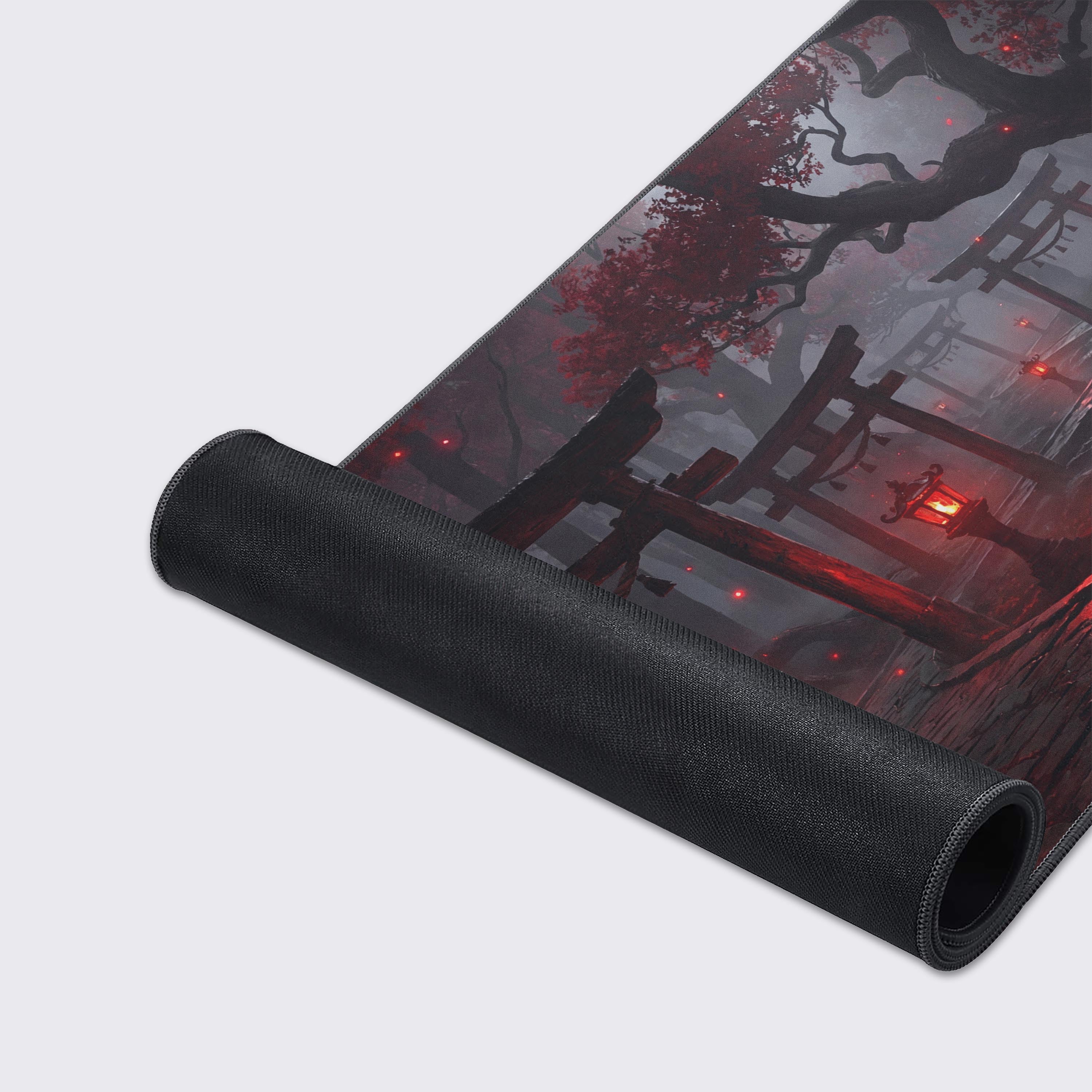 A close-up of the Spirit Gate Way gaming desk mat, highlighting the smooth fabric texture and durable stitched edges on the haunted shrine design. - Epic Design Pads & Mousepads