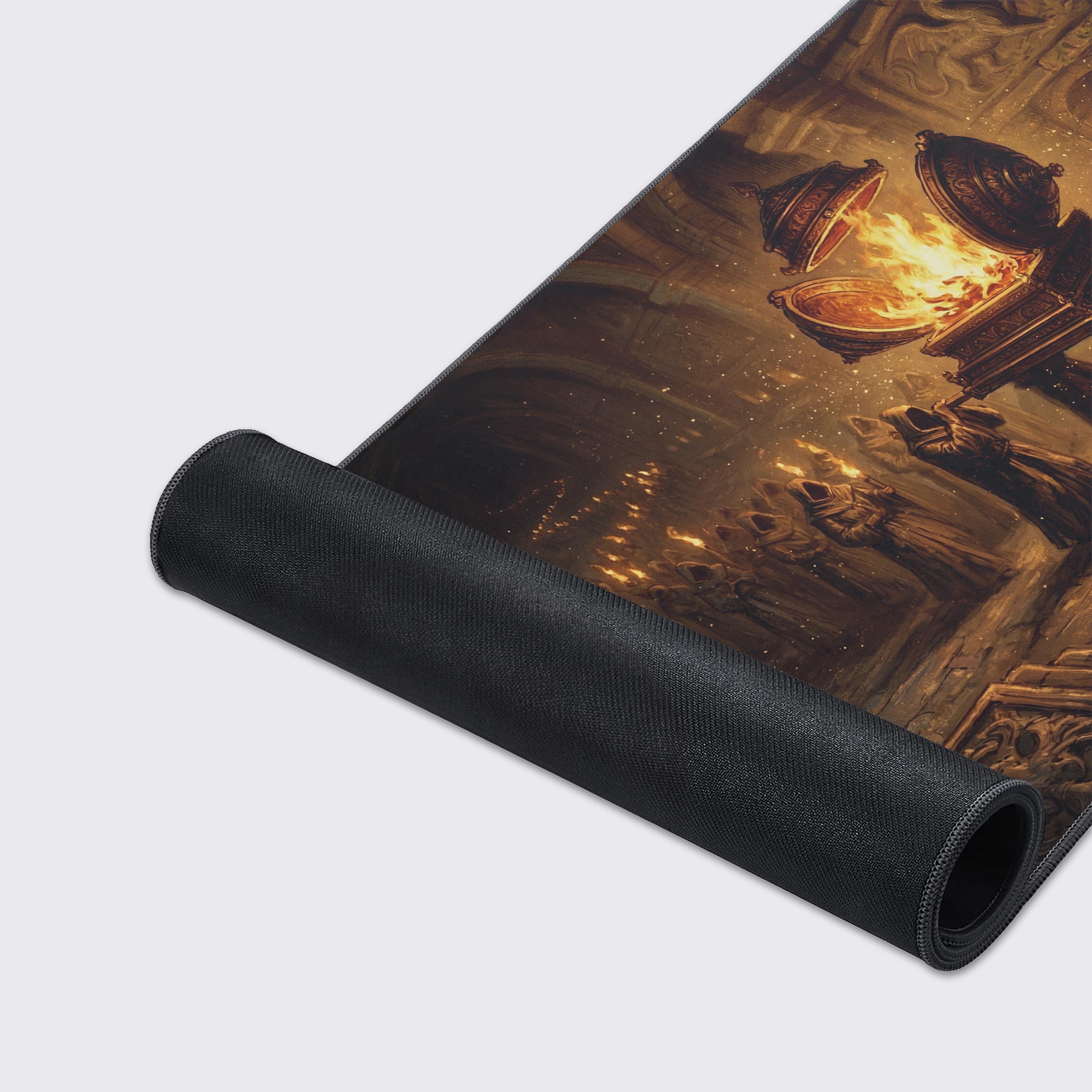 A close-up of the Ashen Pilgrimage gaming desk mat highlights its durable stitched edges and smooth fabric surface depicting a torch-lit fantasy scene. - Epic Design Pads & Mousepads