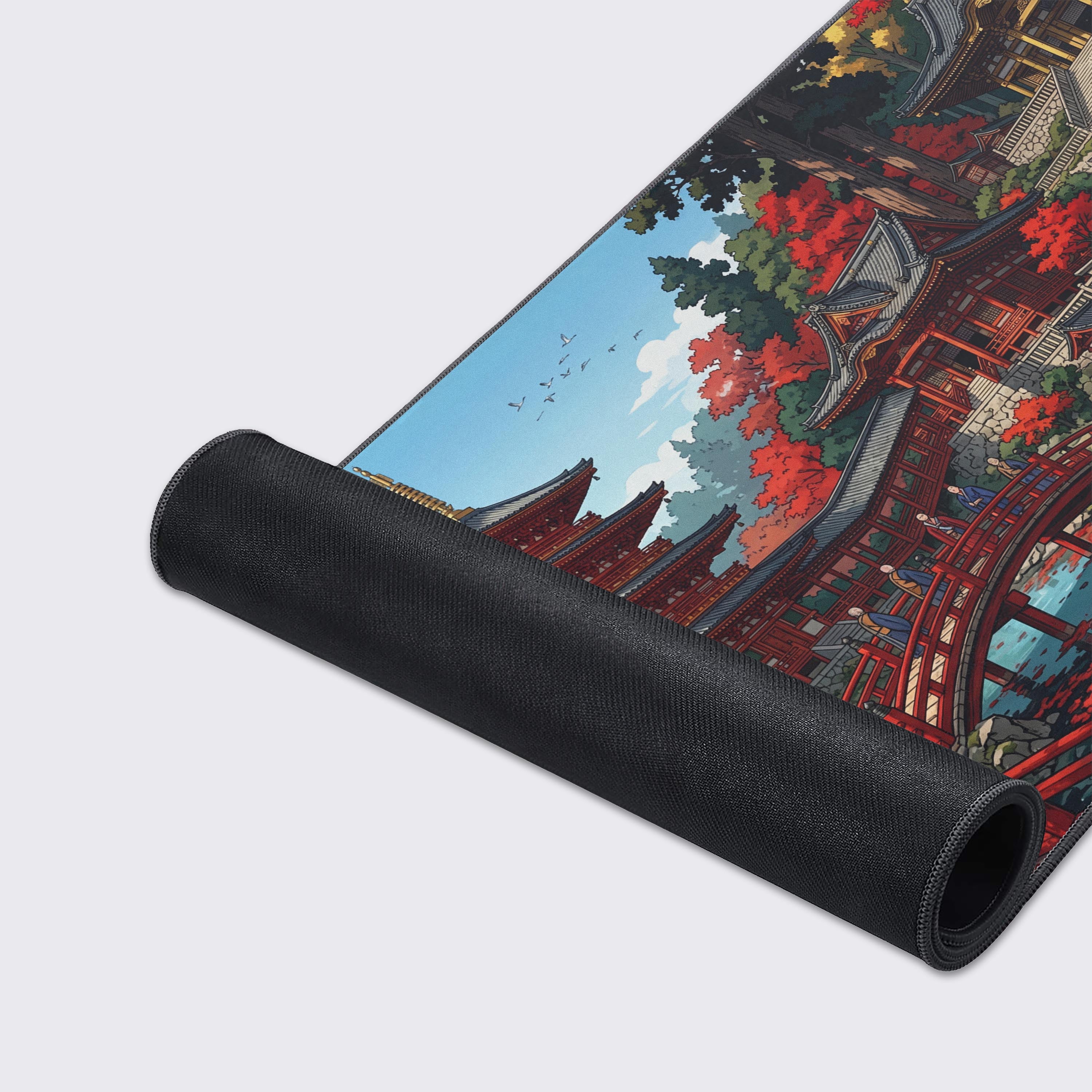 A close-up of the Crimson Pagoda gaming desk mat, highlighting the high-quality fabric texture and durable stitched edges of the Japanese landscape artwork. - Epic Design Pads & Mousepads