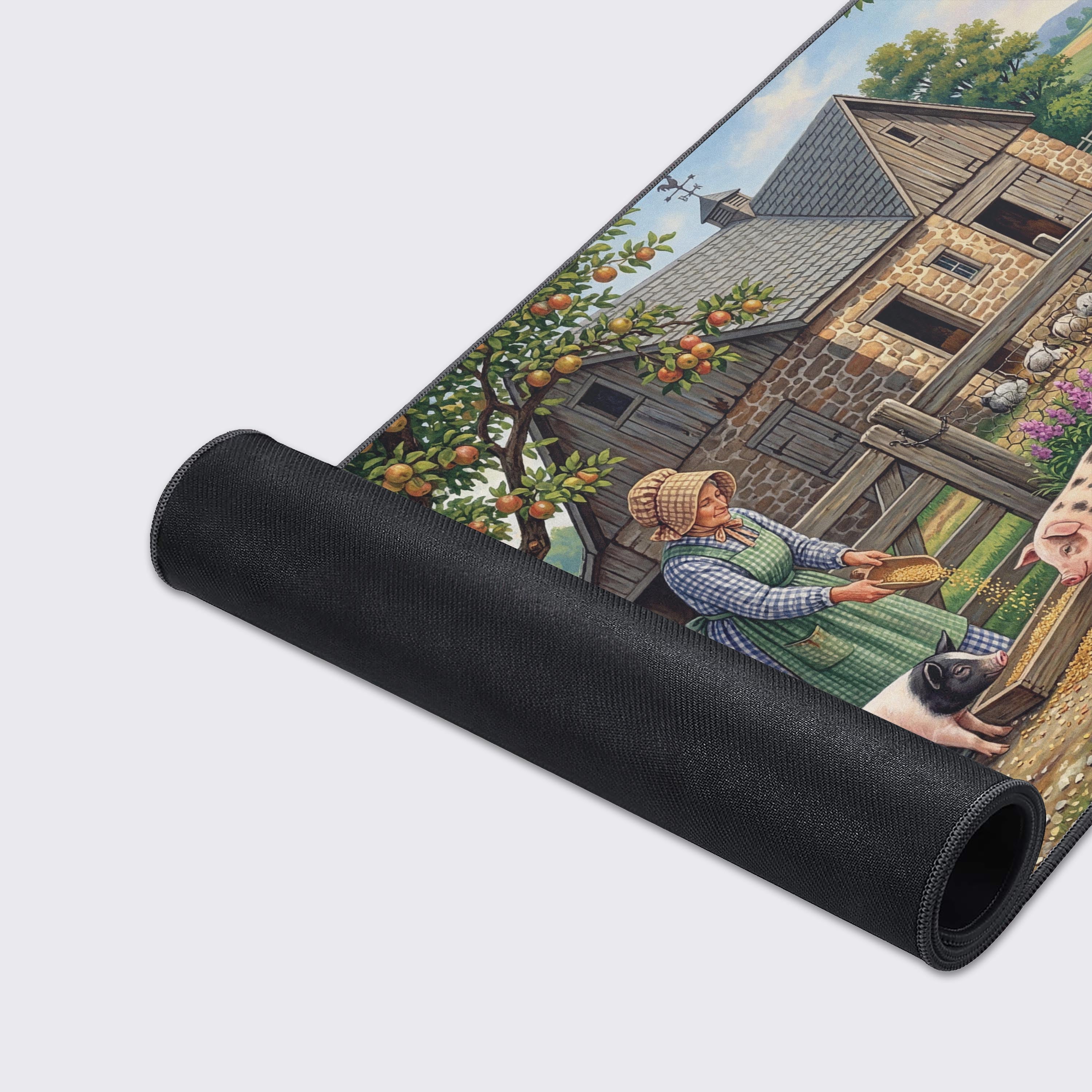 A close-up of the Old World Homestead gaming desk mat, highlighting the smooth texture and stitched edges of the vibrant farm life illustration. - Epic Design Pads & Mousepads