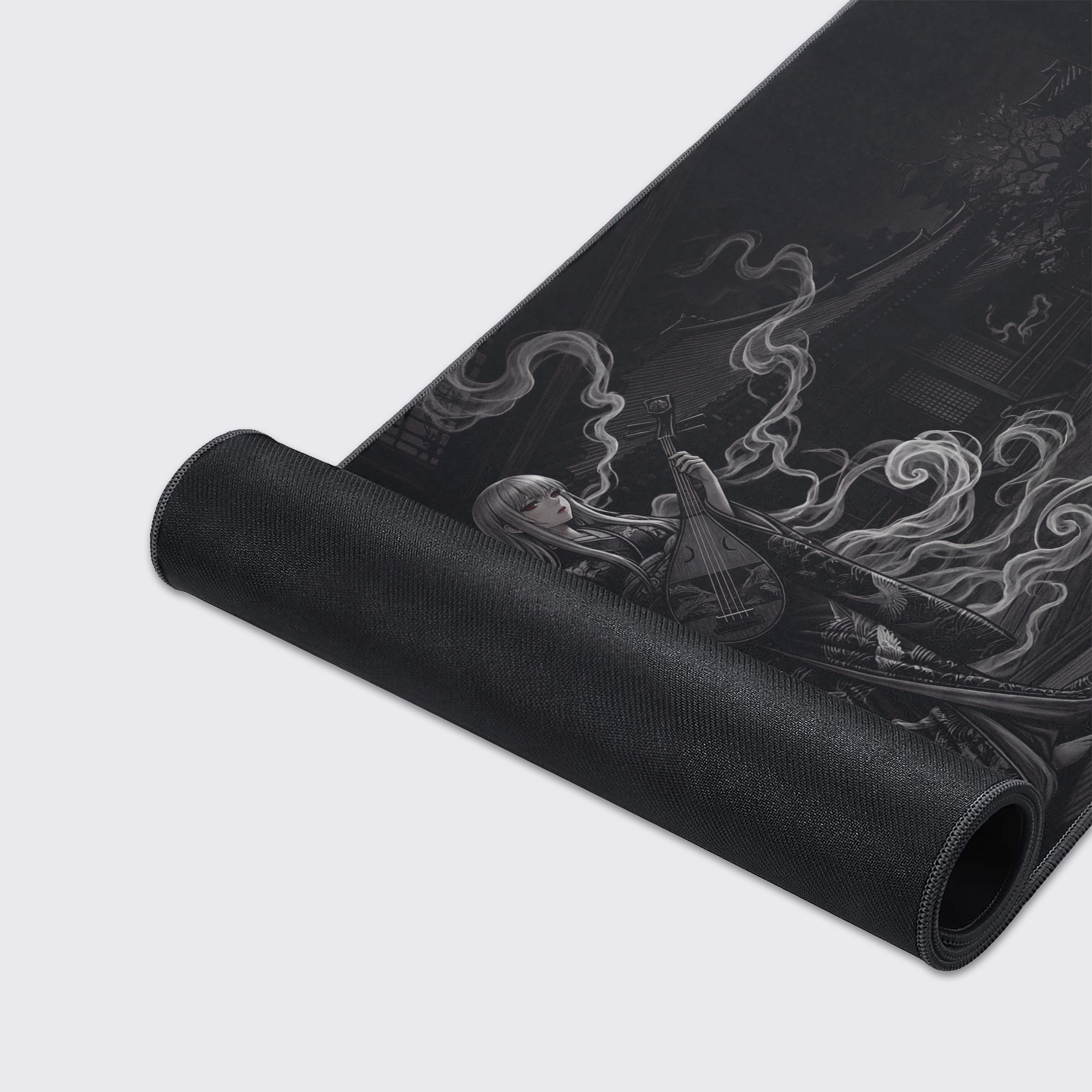 A close-up of the Phantom Melody gaming desk mat highlighting the detailed monochrome art of a Japanese temple and the premium anti-fray stitched edges. - Epic Design Pads & Mousepads