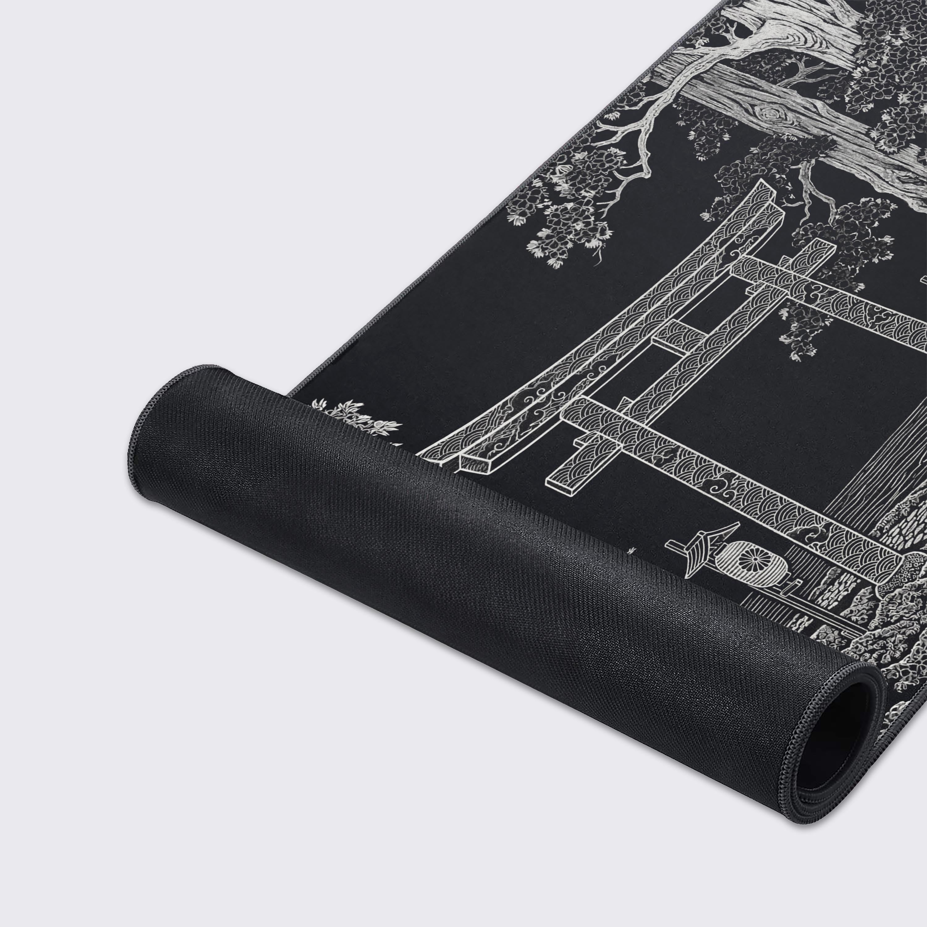 A close-up of the Ancient Threshold gaming desk mat, highlighting the detailed line art of the Japanese forest design and the high-quality stitched edges for durability. - Epic Design Pads & Mousepads