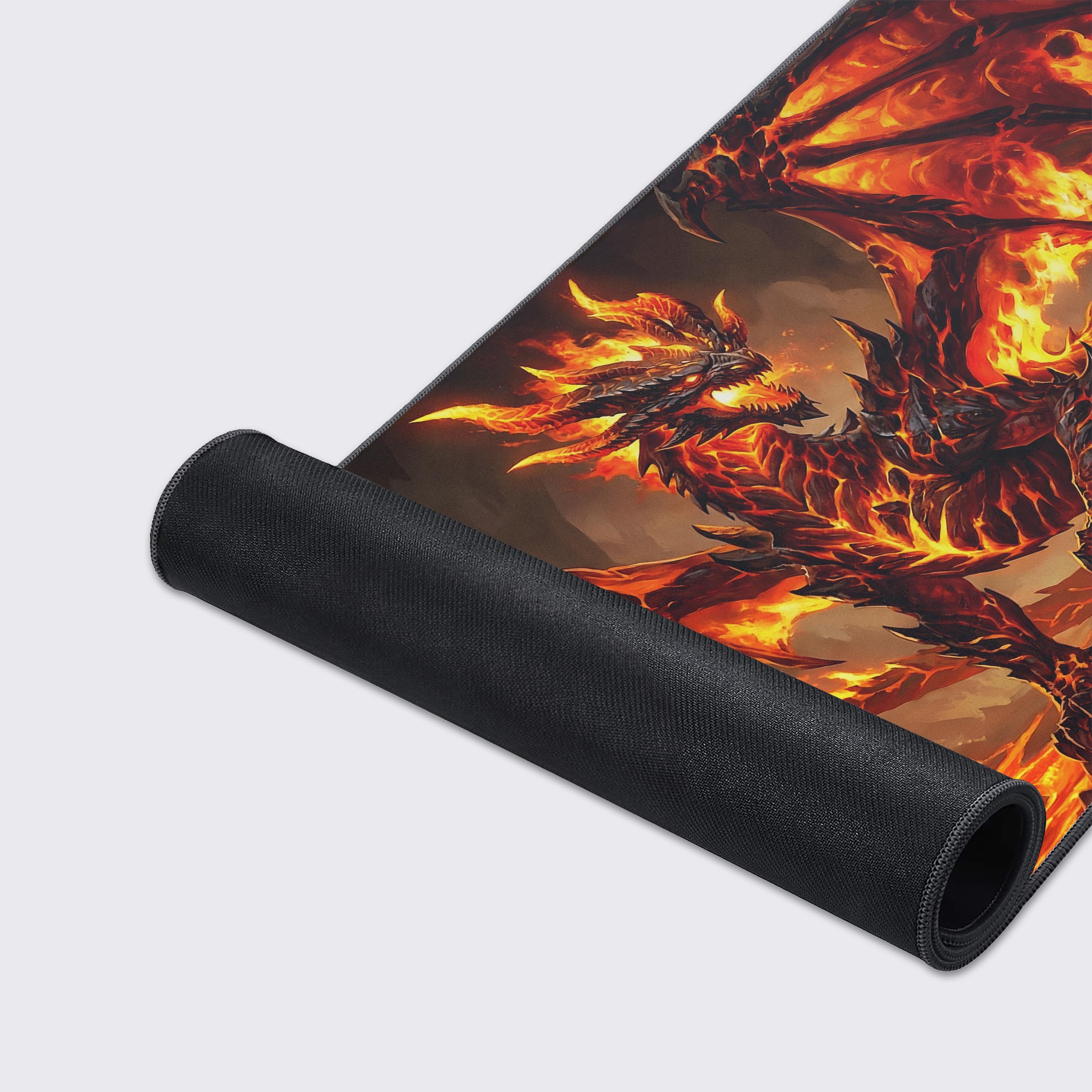 Close-up of the Magma Dragon gaming desk mat highlighting the durable stitched edges and smooth, water-resistant surface. - Epic Design Pads & Mousepads