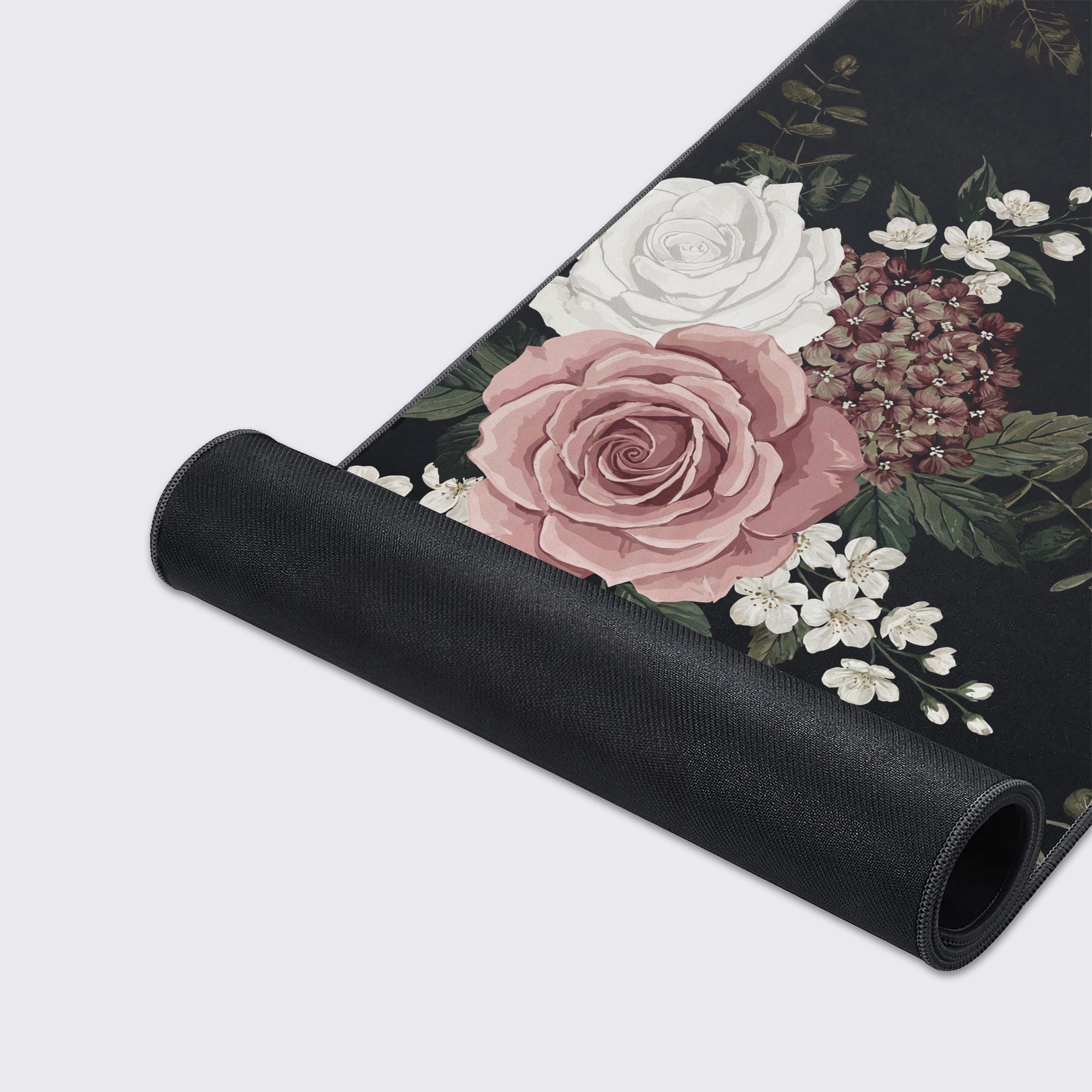 A close-up of the Shadowed Grace floral desk mat, showcasing the high-quality stitched edges, smooth glide surface, and non-slip rubber base. - Epic Design Pads & Mousepads
