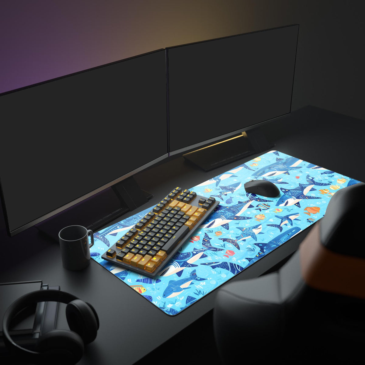 Sharks and Fish Desk Pad in a dark gaming setup with a mechanical keyboard, a mouse and headphones