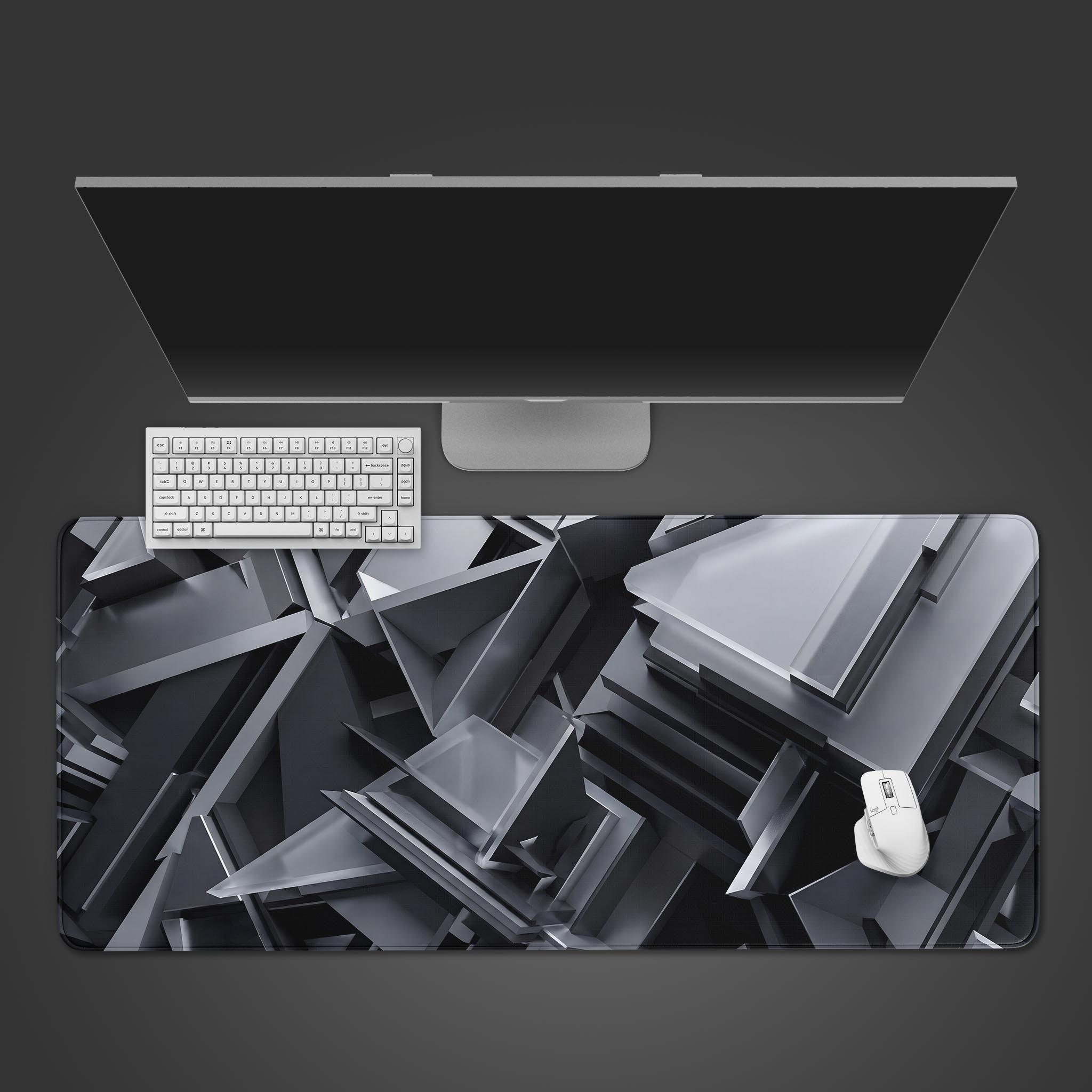 Abstract 3D silver triangles desk mat on a pristine white desk surface