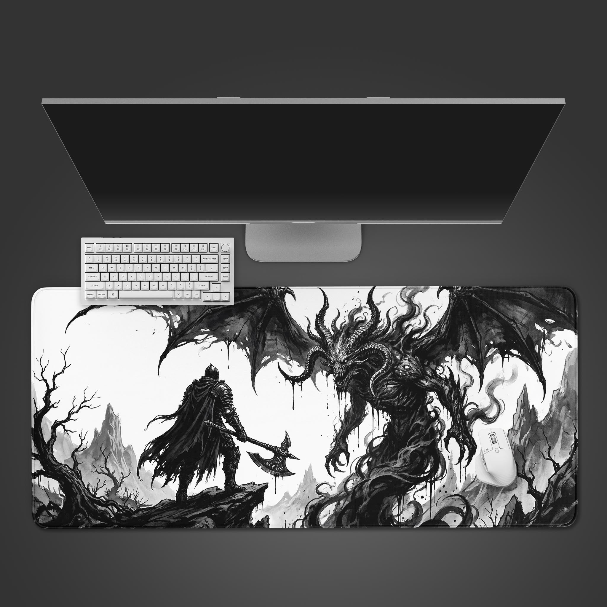 A top-down view of the Abyssal Confrontation gaming desk mat. A white keyboard and mouse sit on the monochrome artwork depicting a knight battling a large demon. - Epic Design Pads & Mousepads