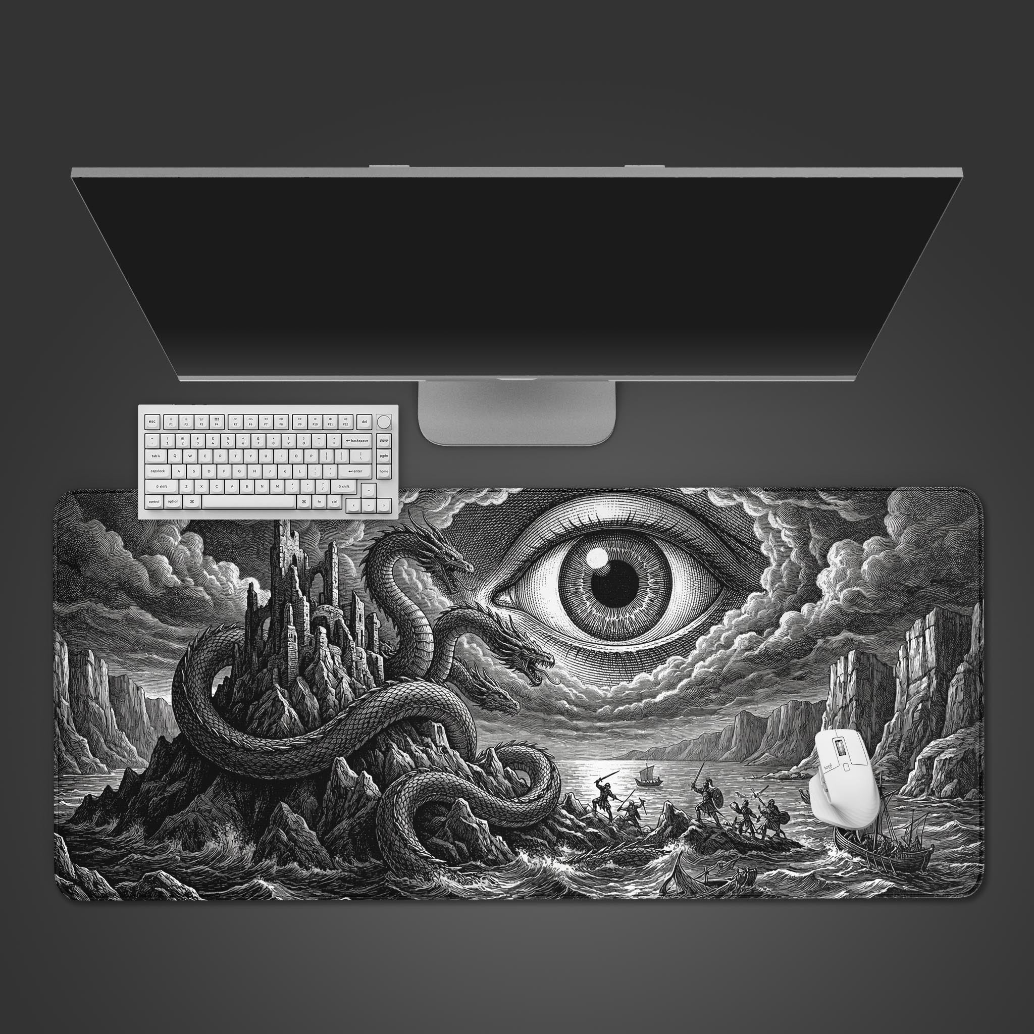 Top-down view of the Abyssal Gaze gaming desk mat, featuring a monochrome hydra and eye design. A white keyboard and mouse are placed on the mat below a sleek monitor. - Epic Design Pads & Mousepads