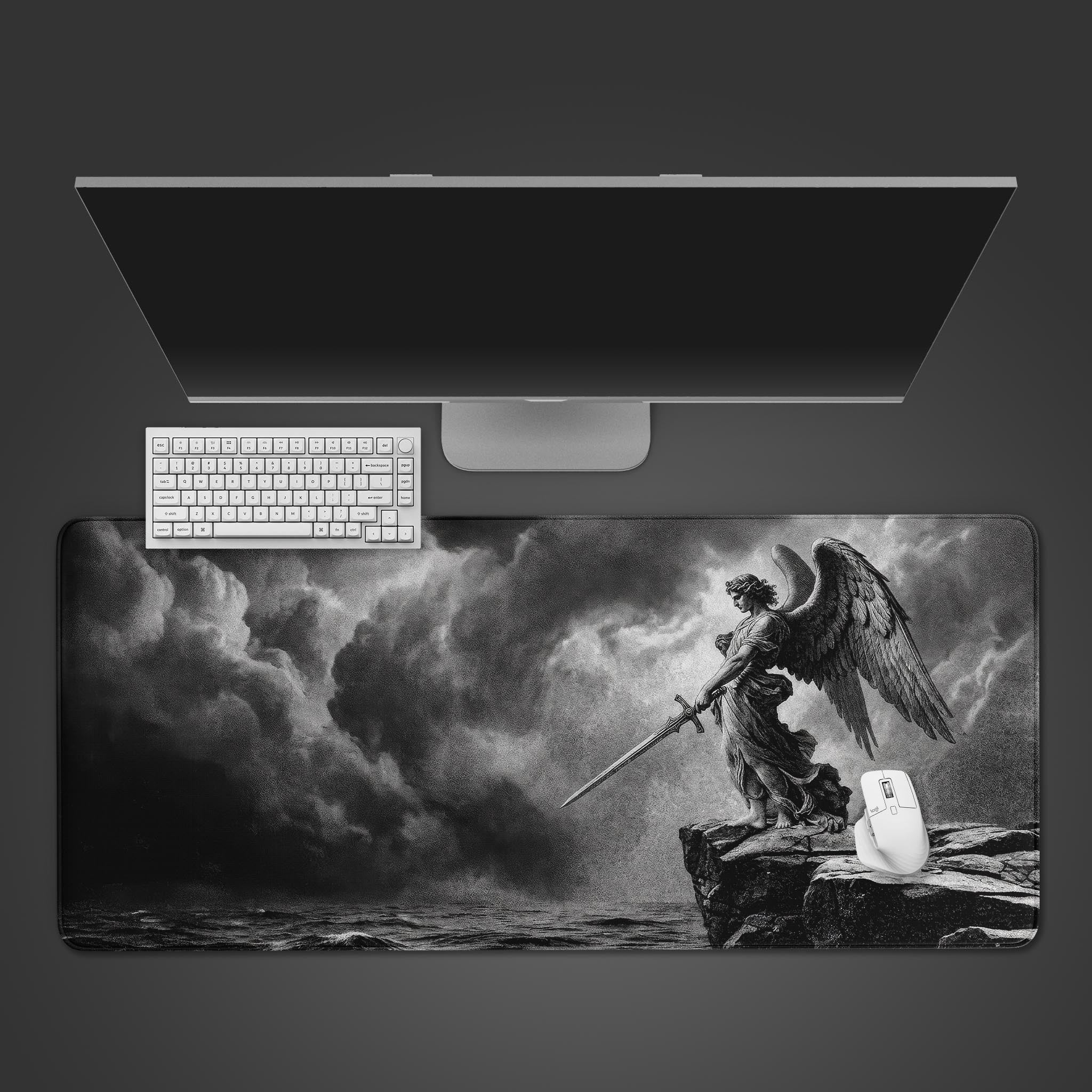 A greyscale desk mat featuring a classical engraving-style illustration of an angel holding a sword on a cliff.