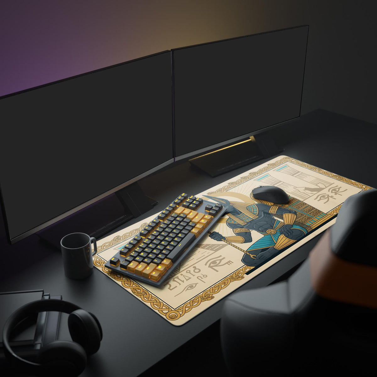 Anubis desk mat on a dark desk with dual monitors, black and gold keyboard, mouse, mug and headphones - Epic Design Pads & Mousepads