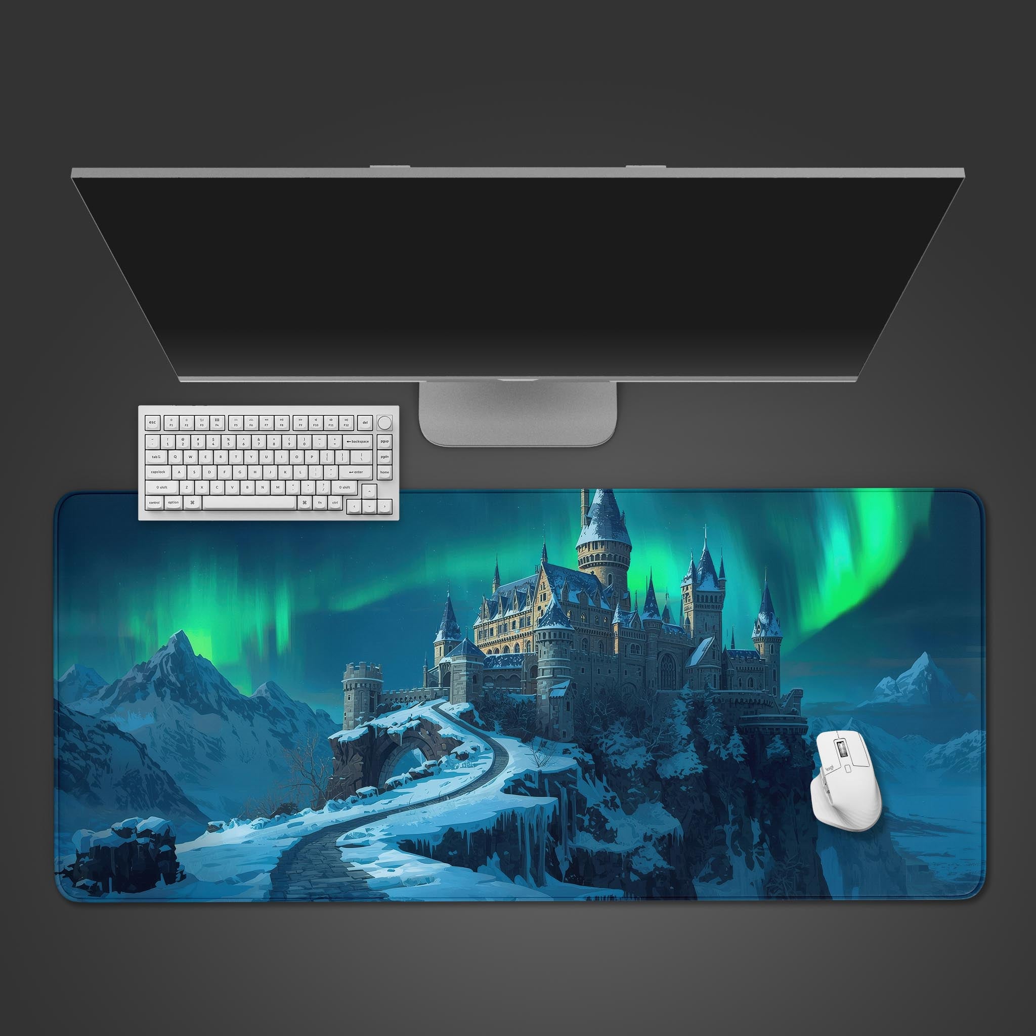 Aurora Citadel fantasy desk mat showing a magical castle under northern lights, top-down view on a desk with a keyboard and mouse. - Epic Design Pads