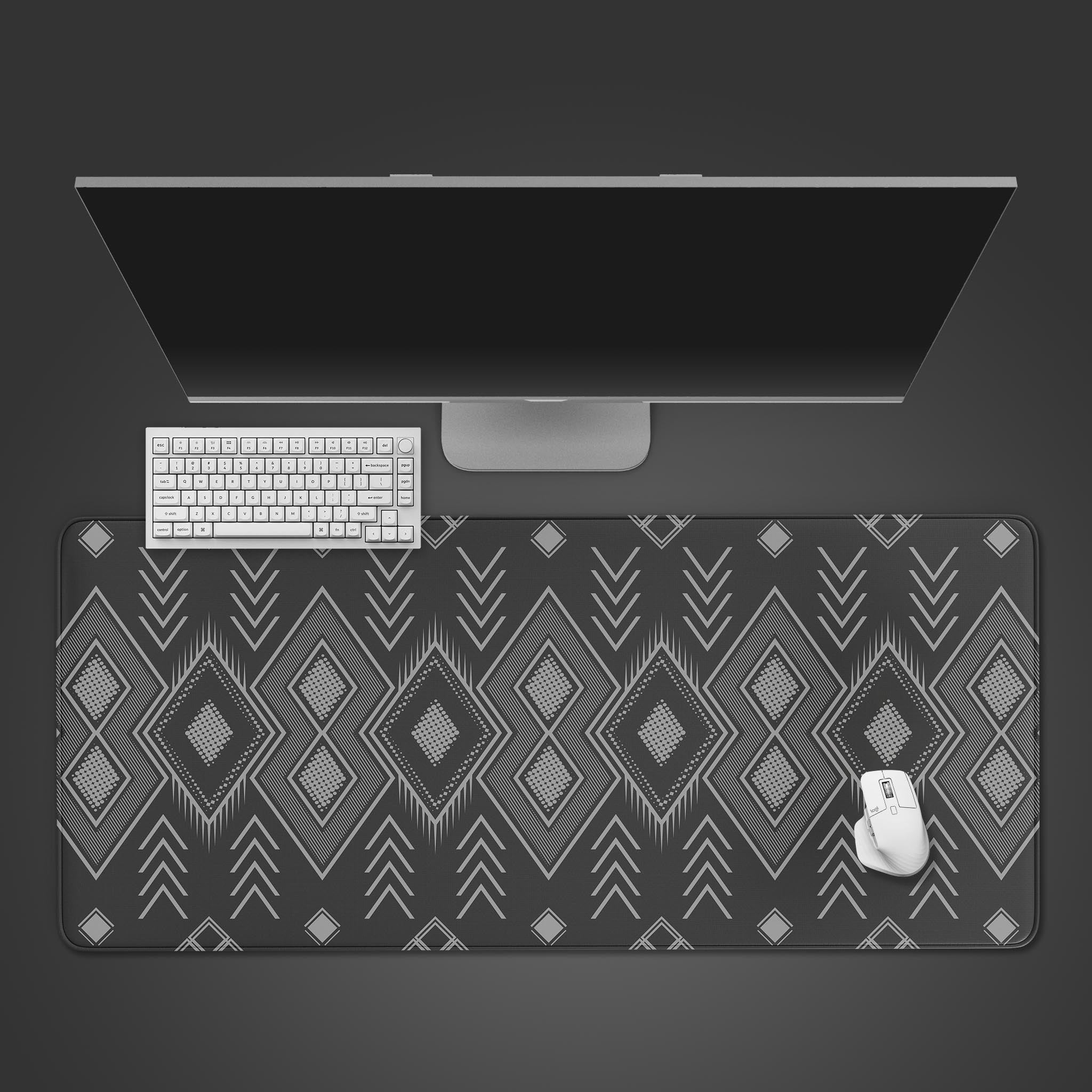 Aztec Gray desk mat with geometric tribal pattern, shown in a top-down view with a modern keyboard and mouse, creating a sophisticated workspace. - Epic Design Pads & Mousepads