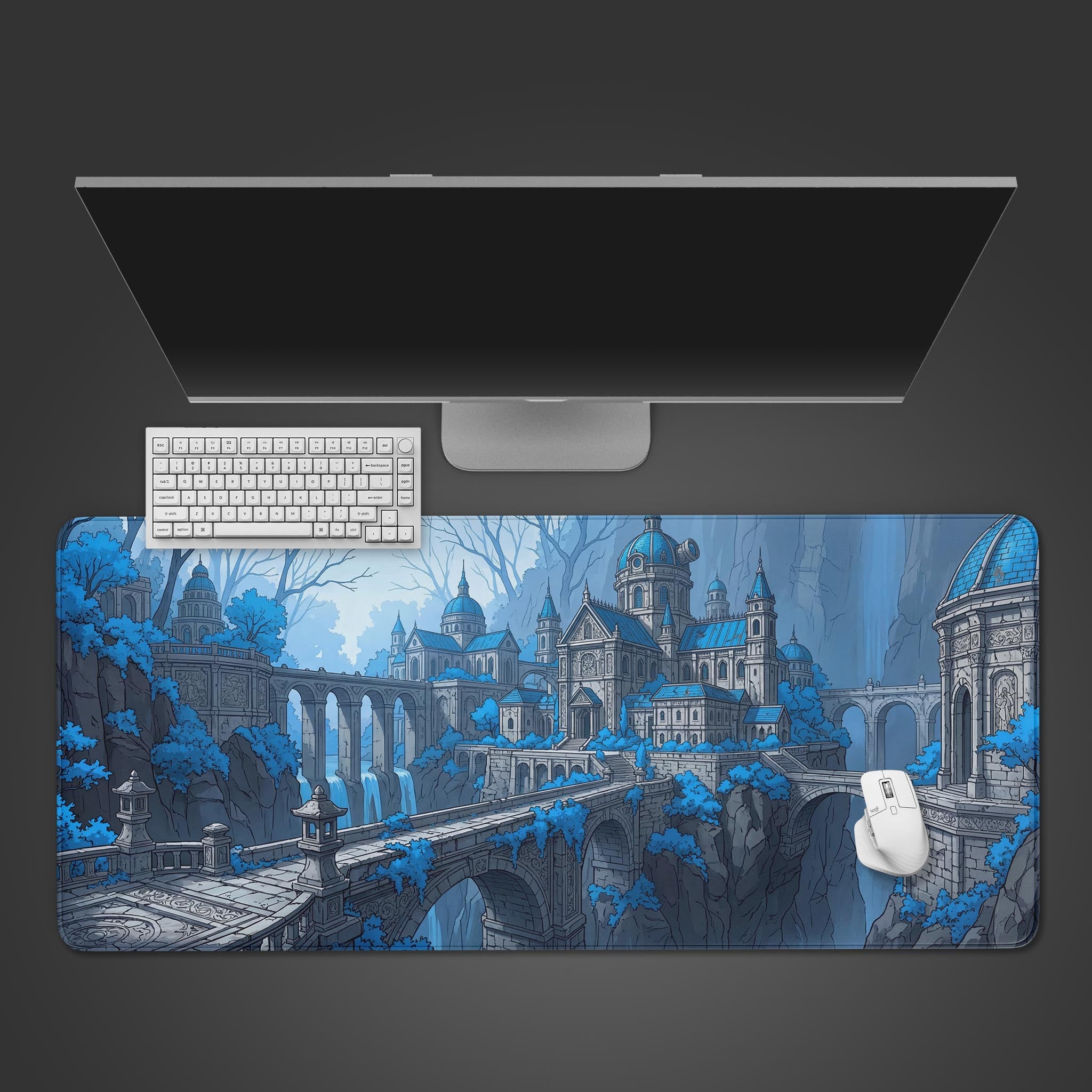 Top-down view of the Azure Spire gaming desk mat featuring a blue fantasy citadel, with a white keyboard and mouse on top. - Epic Design Pads & Mousepads