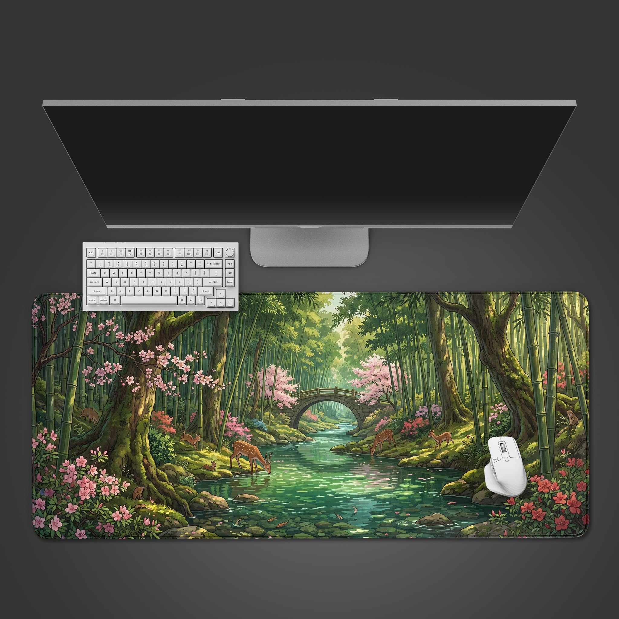 A serene bamboo forest desk mat featuring cherry blossoms and deer drinking from a river.