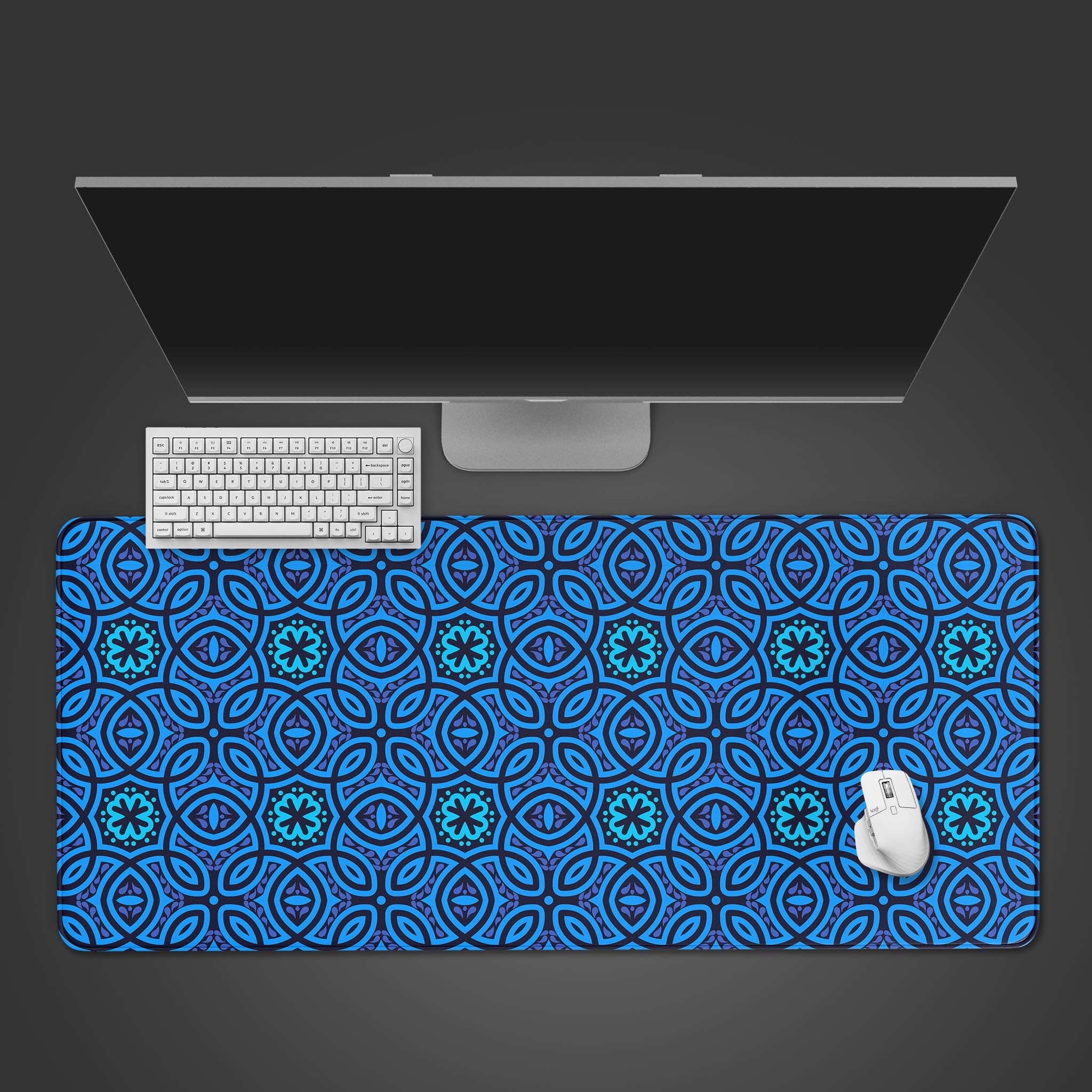 Batik pattern desk mat with intricate blue indigo design, shown in a top-down view with a keyboard and mouse. - Epic Design Pads & Mousepads