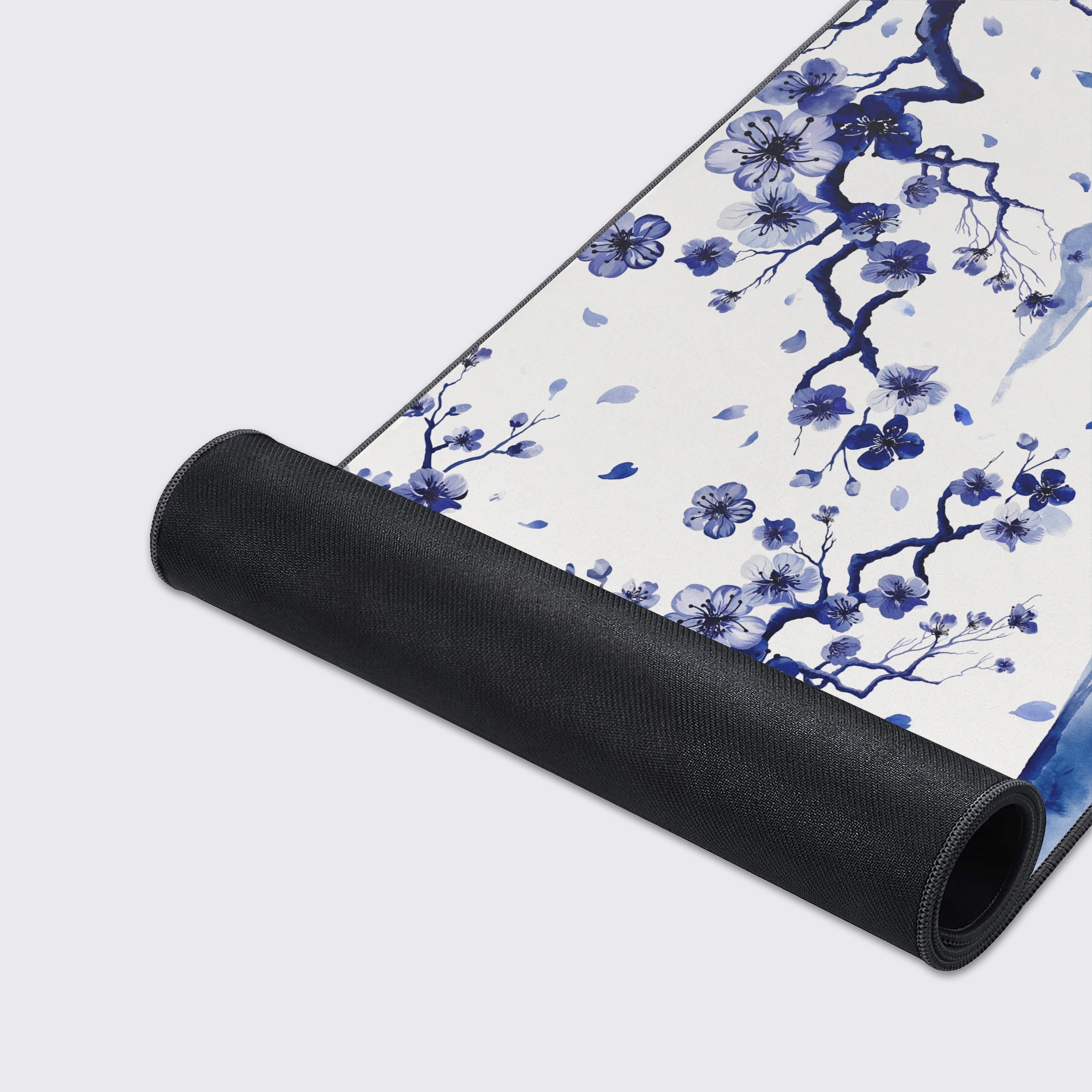 Top-down view of the blue porcelain style desk pad highlighting its expansive size for keyboards and mice.