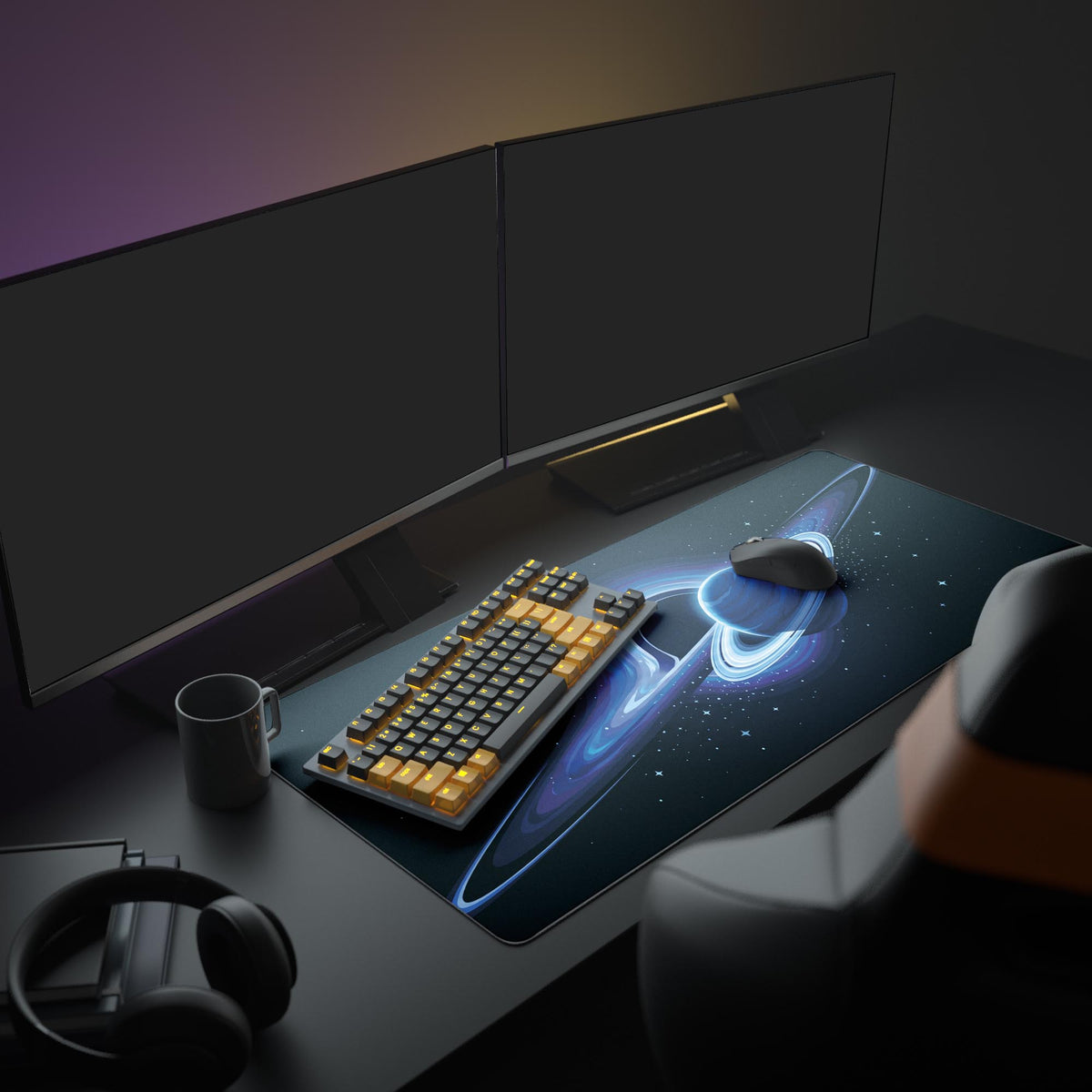 Desk mat on a dark desk with dual monitors, amber-keyed keyboard, mug and headphones; ringed blue planet and black hole art.