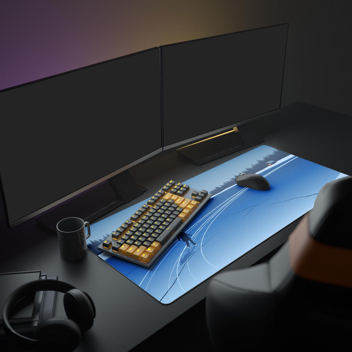 Frozen lake desk mat with skater on a dark desk with two monitors, orange and black keyboard, mouse, mug, headphones