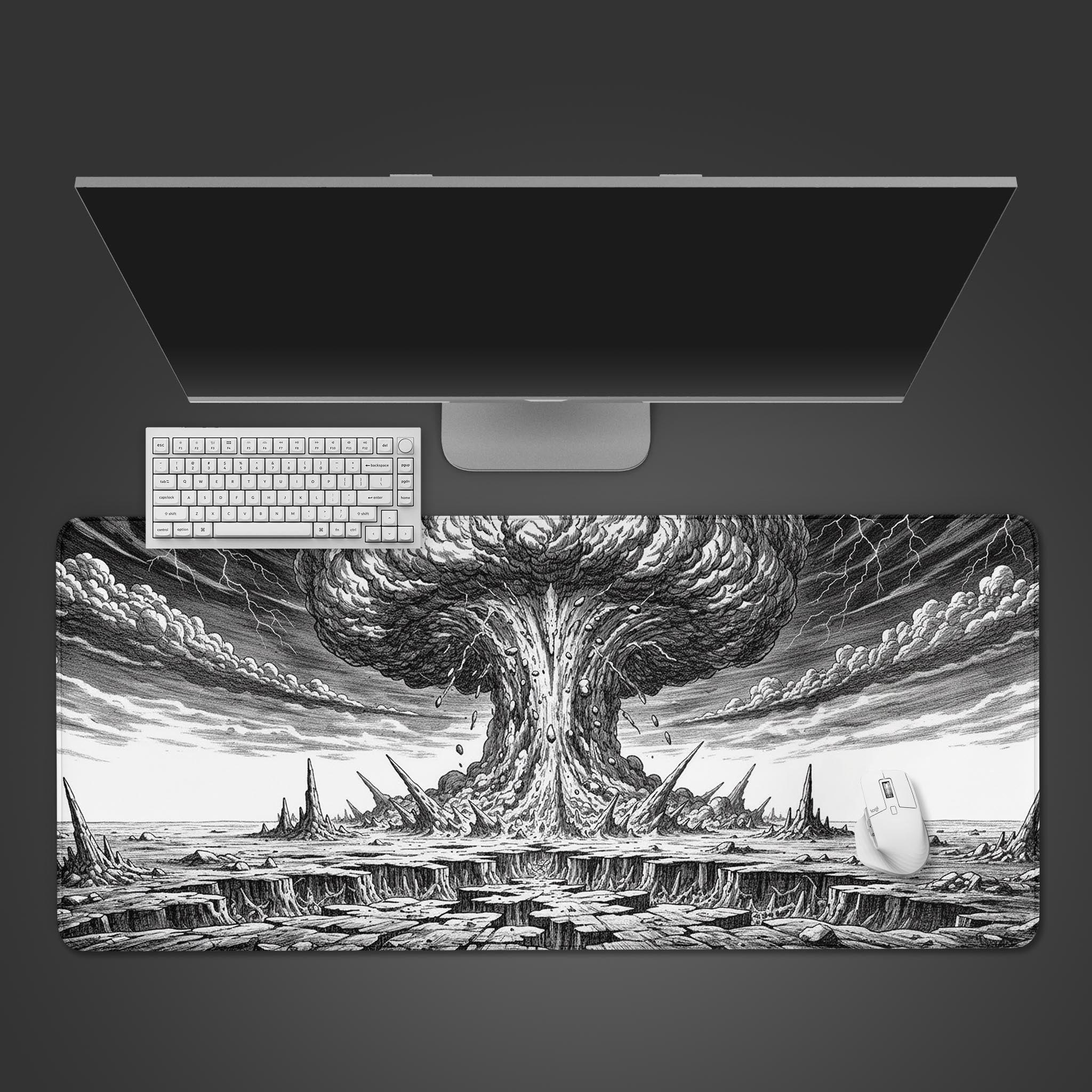 Cataclysmic explosion gaming desk mat in a black and white graphic novel style, shown on a desk with a keyboard and mouse. - Epic Design Pads