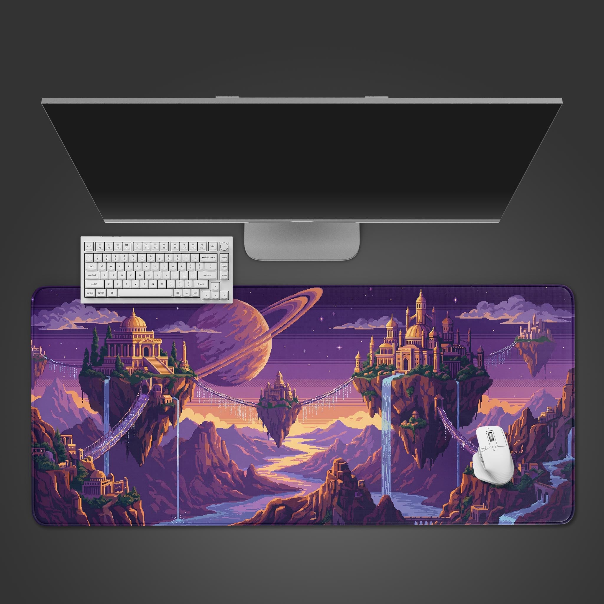 Top-down view of the Celestial Pixel Isles gaming desk mat, displaying its vibrant purple pixel art beneath a modern monitor, white keyboard, and mouse. - Epic Design Pads & Mousepads