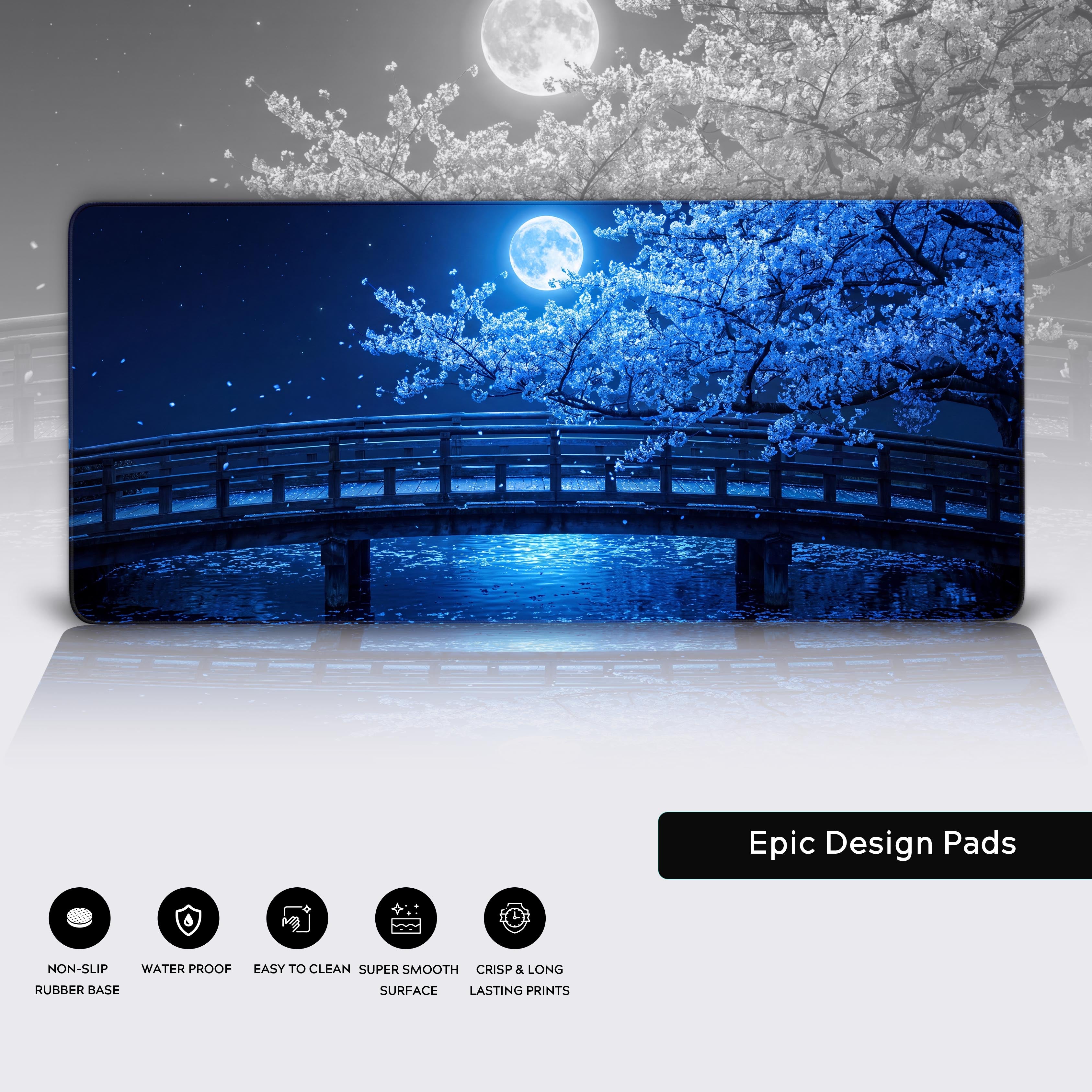 Full view of the blue night aesthetic desk mat showing the glowing sakura tree, bridge, and calm water setup.