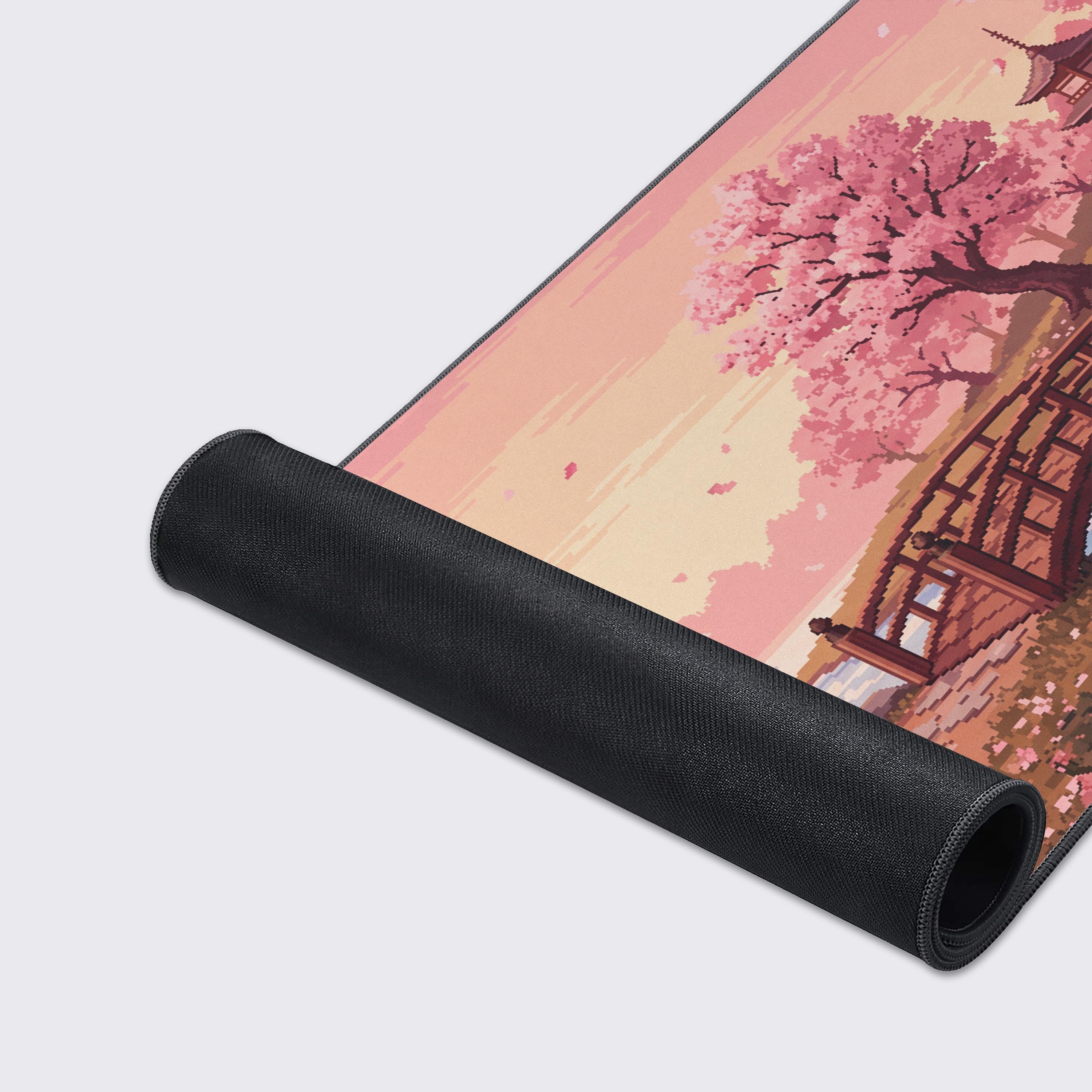 Detail view of the arched wooden bridge and red koi fish swimming in the blue stream of the retro gaming mouse pad.