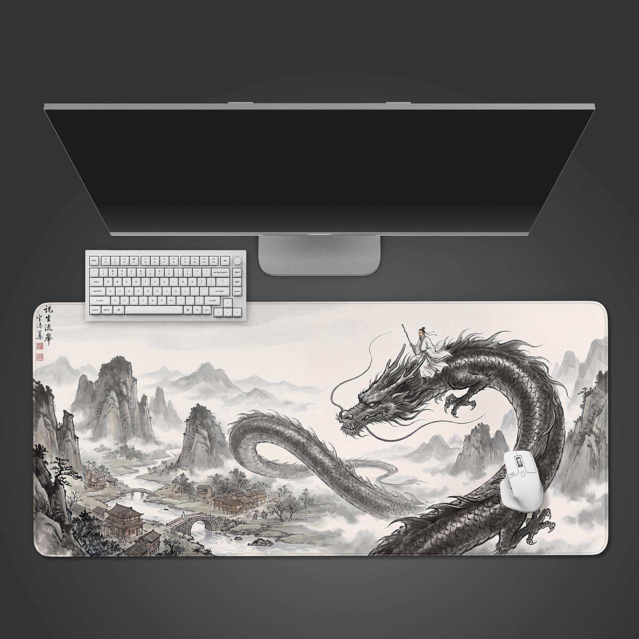 A large desk mat featuring a traditional Chinese ink wash painting of a man riding a serpentine dragon over misty mountains.