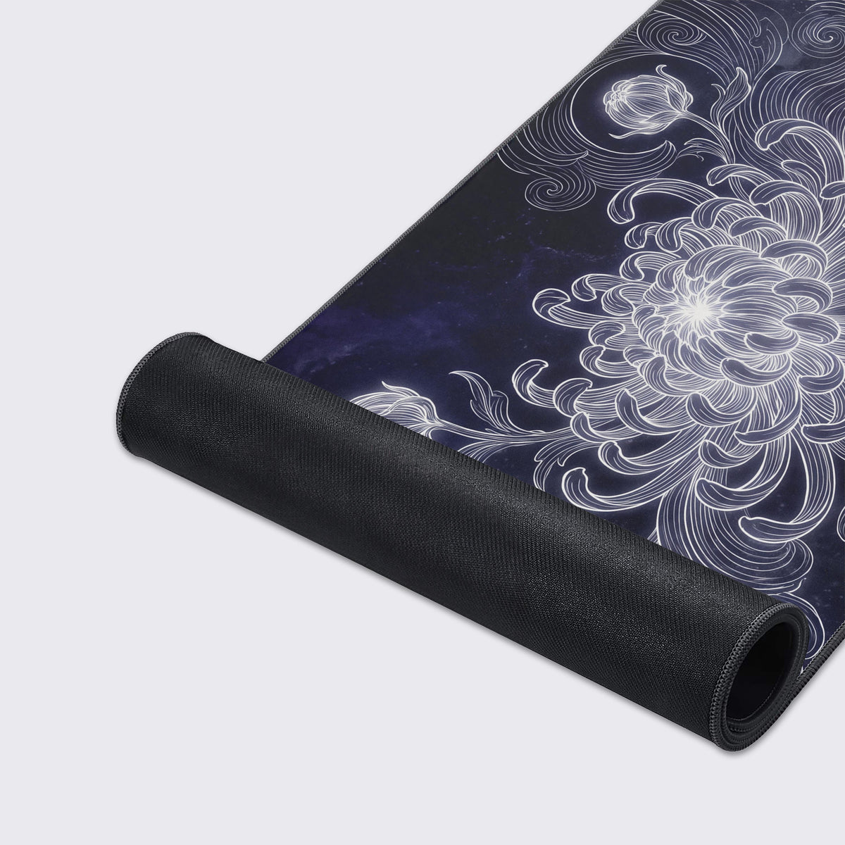 A cosmic floral desk mat floating above a reflective surface with graphic icons displayed below.