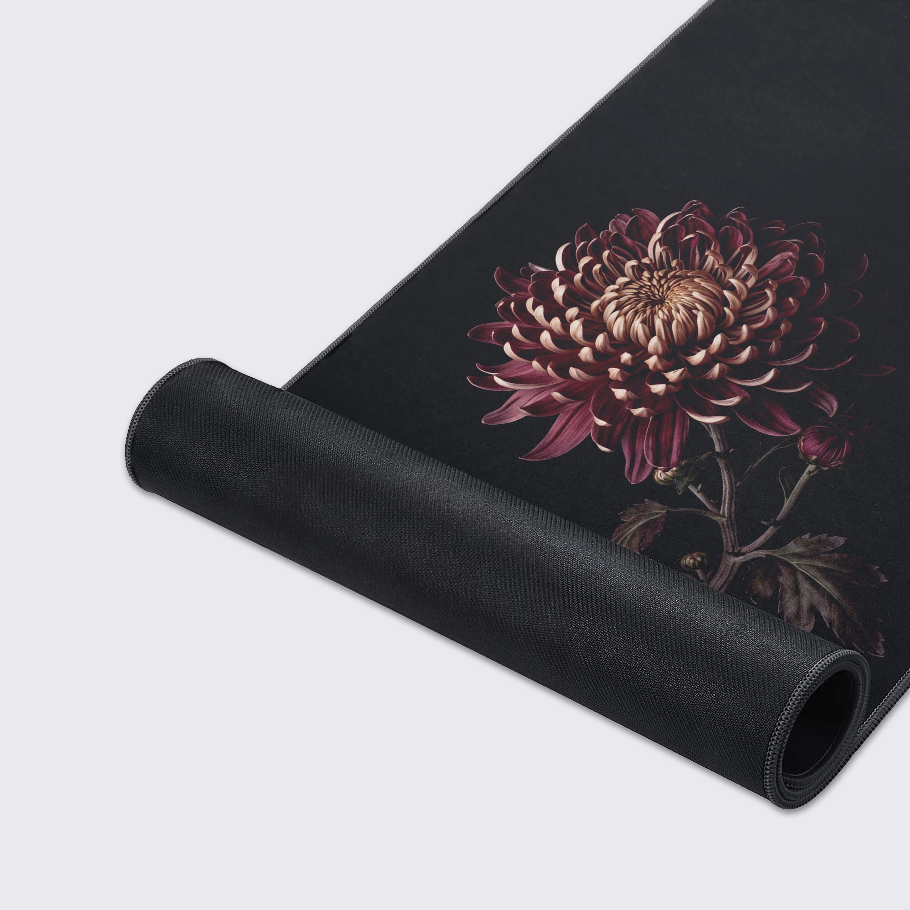 Minimalist black desk mat with dark red floral art, showcasing waterproof and non-slip features