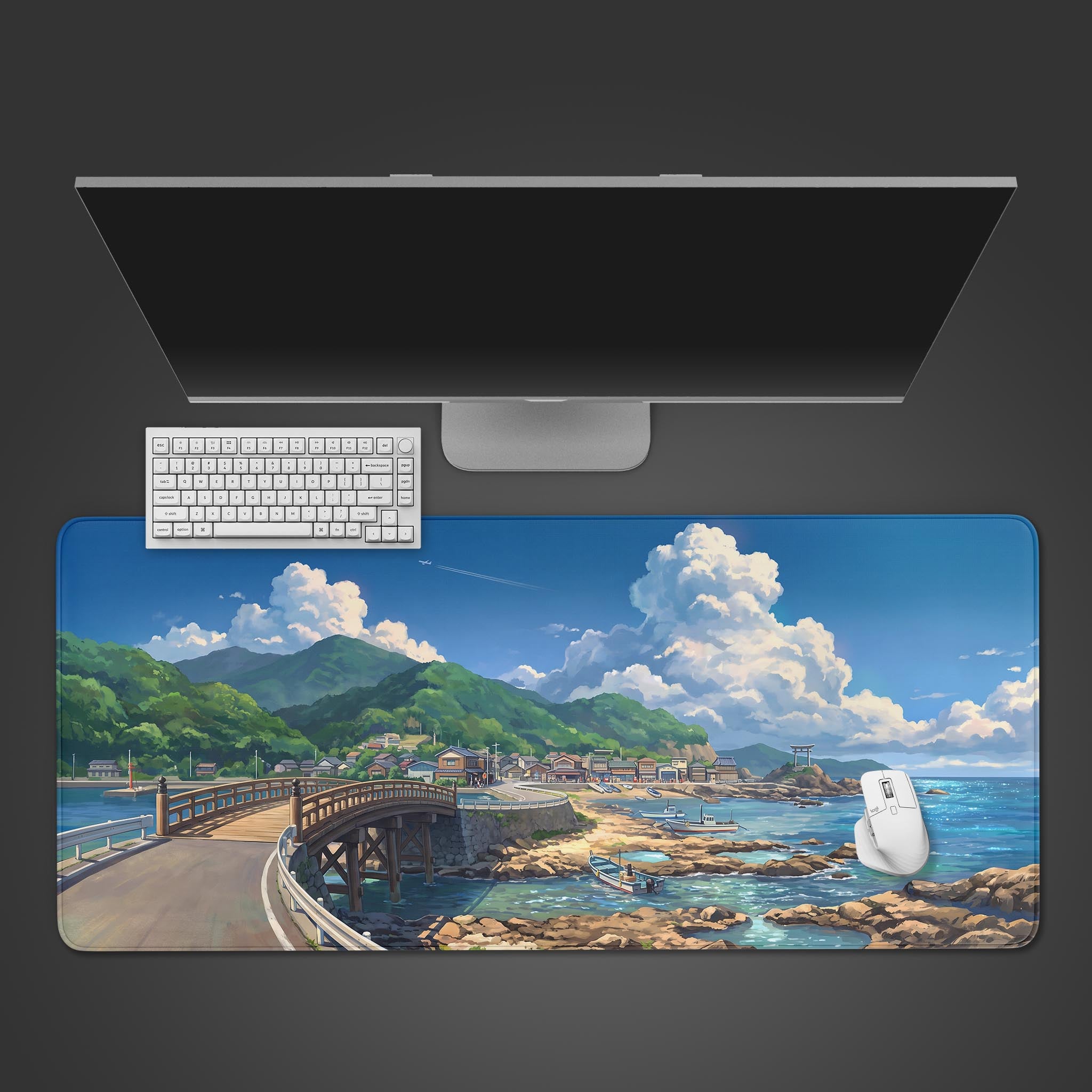 Anime-style desk mat featuring a coastal Japanese village with a wooden bridge, blue ocean, and lush hills.