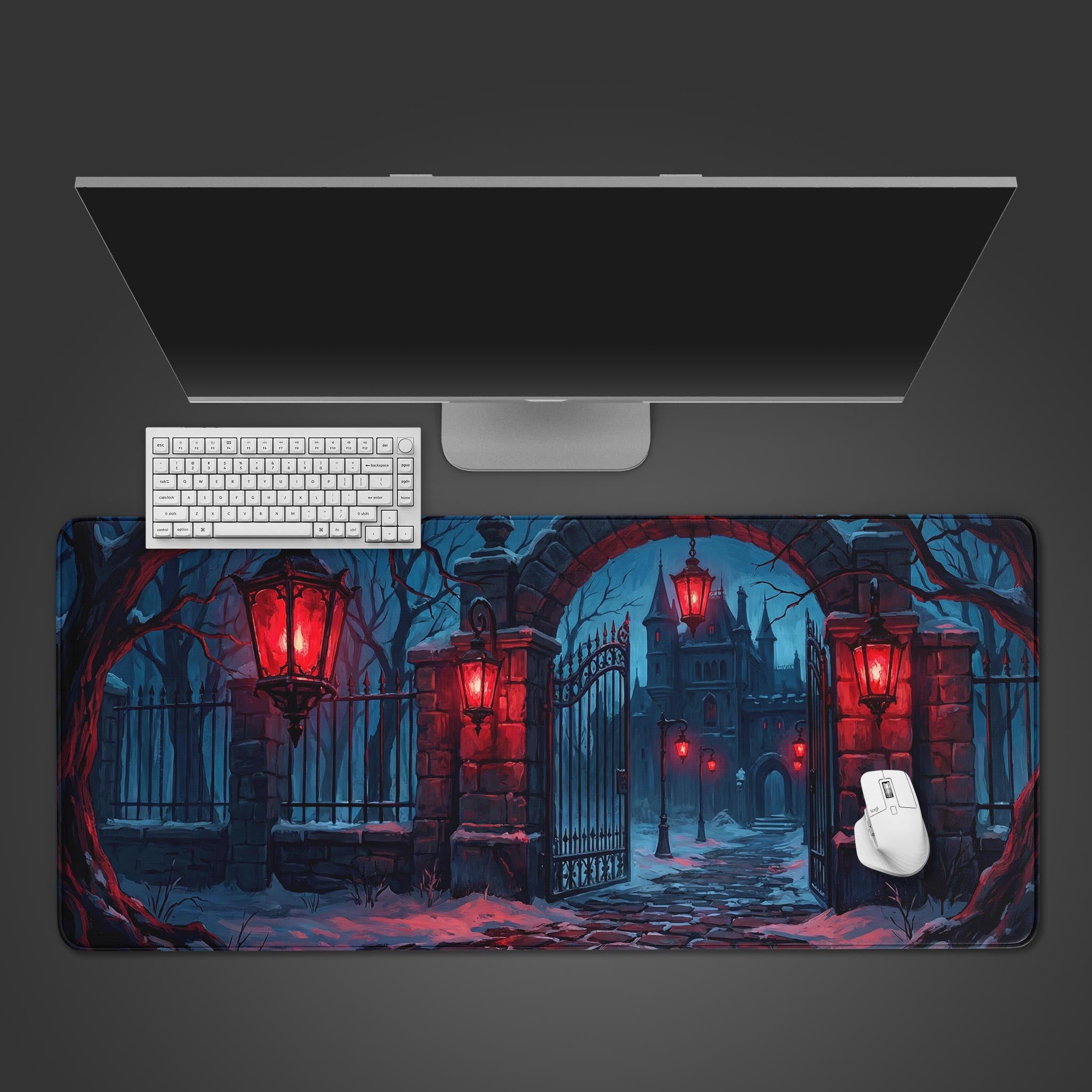 Top-down view of the Crimson Threshold gaming desk mat featuring a gothic winter gate, shown with a white keyboard, mouse, and a sleek monitor on a dark surface. - Epic Design Pads & Mousepads