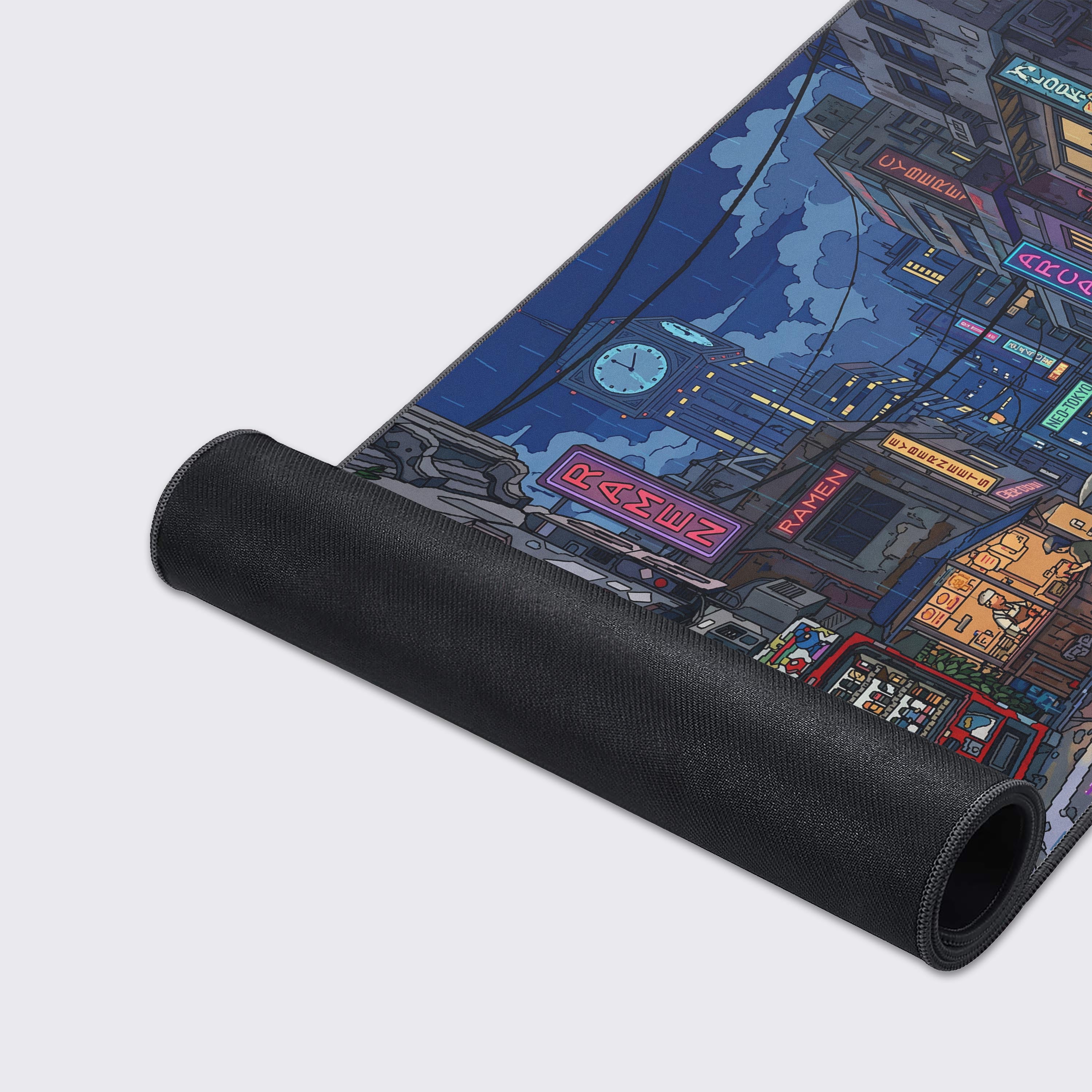 Top-down view of the Neo-Tokyo cityscape desk mat showing intricate building details, an arcade, and a clock tower in the background.