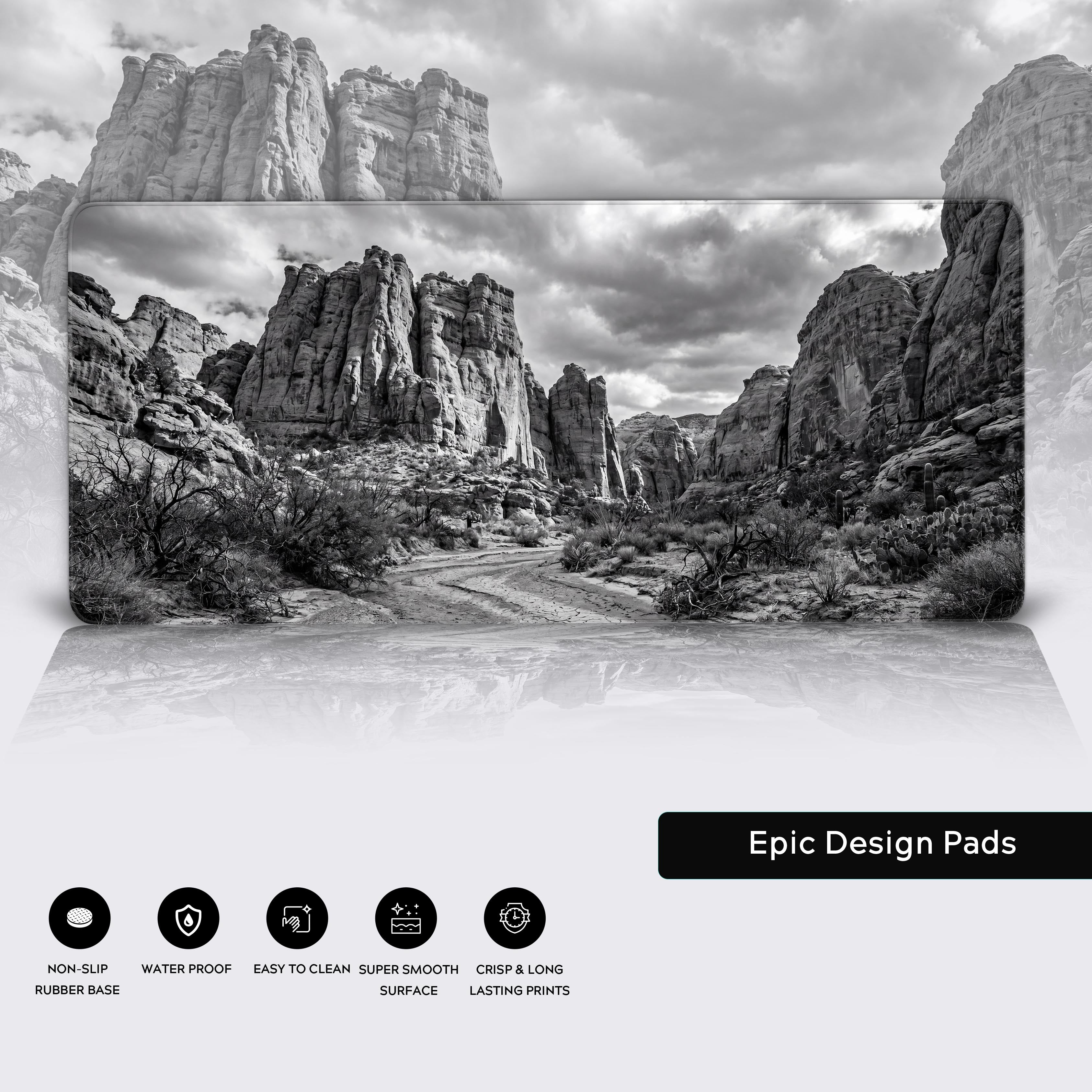 Epic design desk pad showcasing a desert trail landscape in striking grayscale tones
