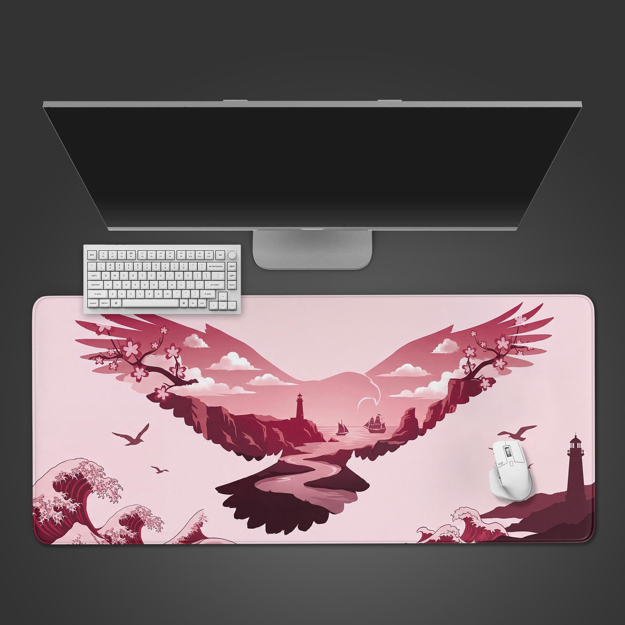 Product image of a pink desk mat featuring an eagle silhouette filled with a coastal lighthouse landscape and cherry blossoms