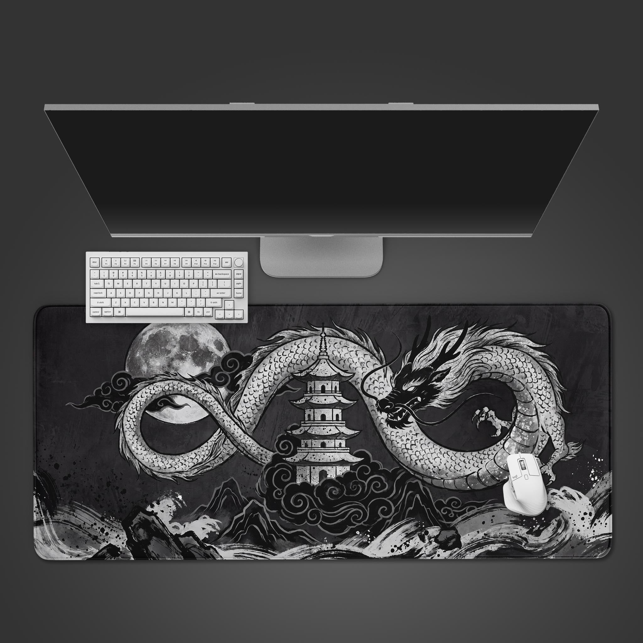 Black and white ink wash style Eastern dragon coiled around a traditional pagoda on a large desk mat