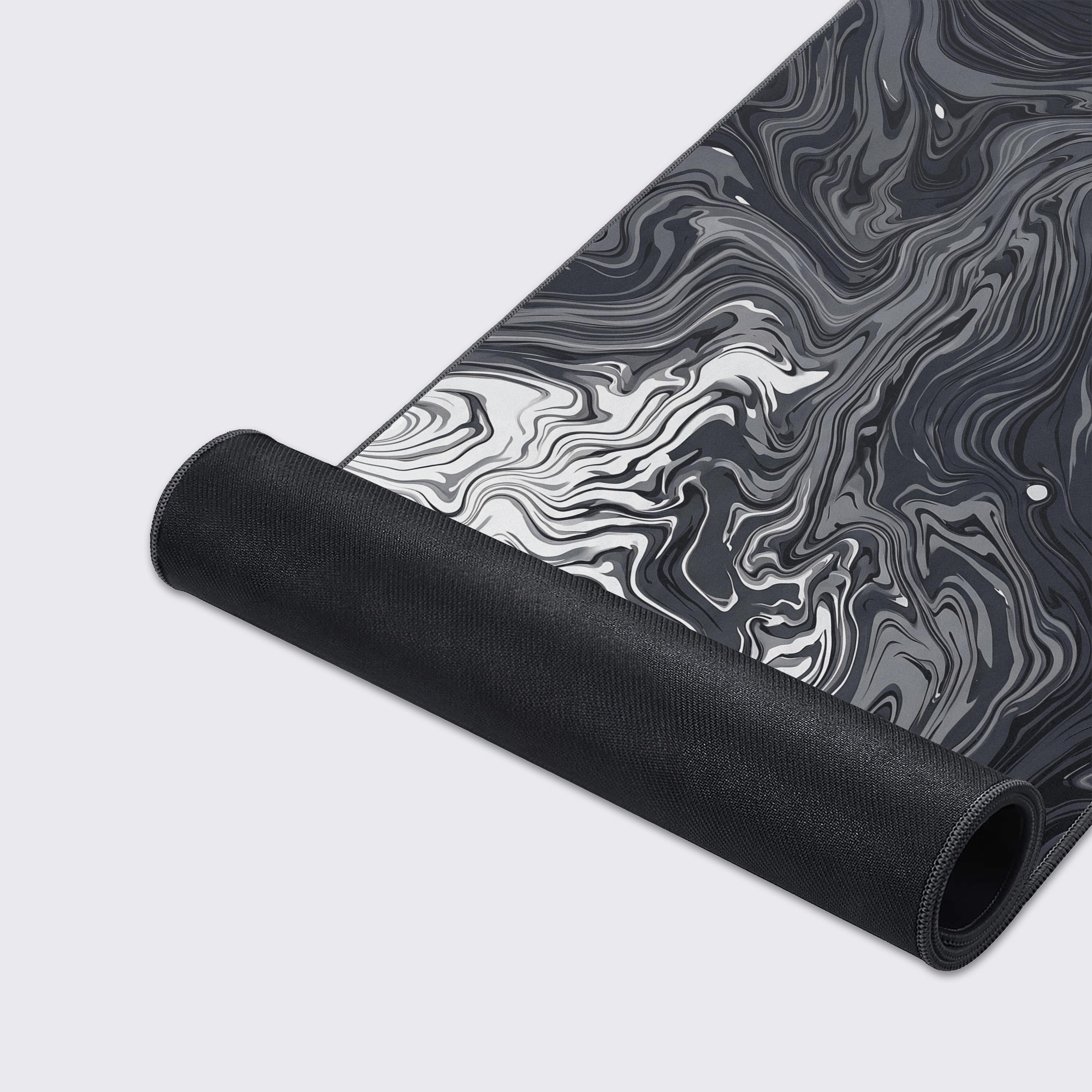Product features of the Ebon Flow desk mat including waterproof, non-slip base, and easy to clean icons.