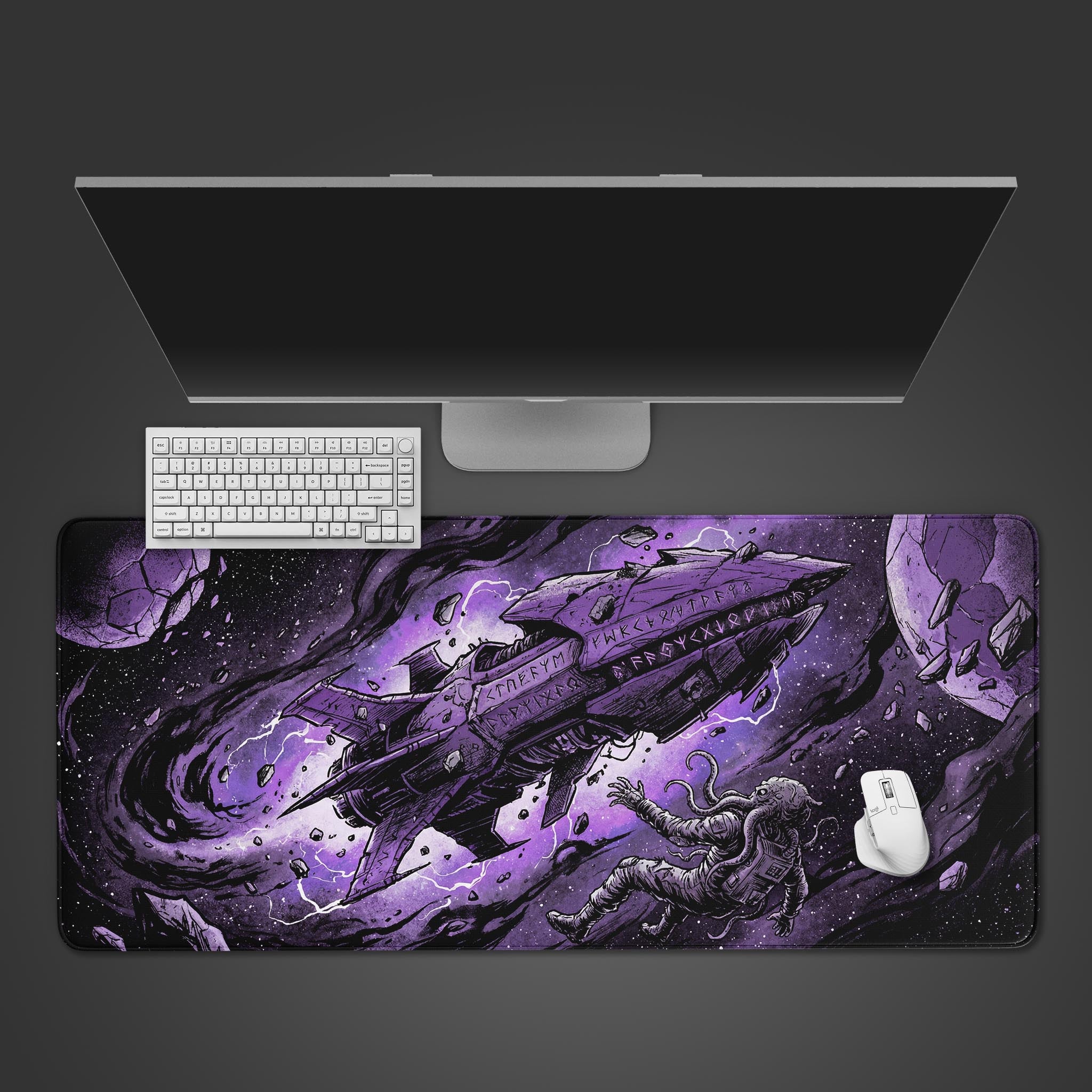 Top-down view of the Eldritch Orbit gaming desk mat featuring a sci-fi spaceship and tentacled astronaut, shown with a white keyboard and mouse on a dark background. - Epic Design Pads & Mousepads