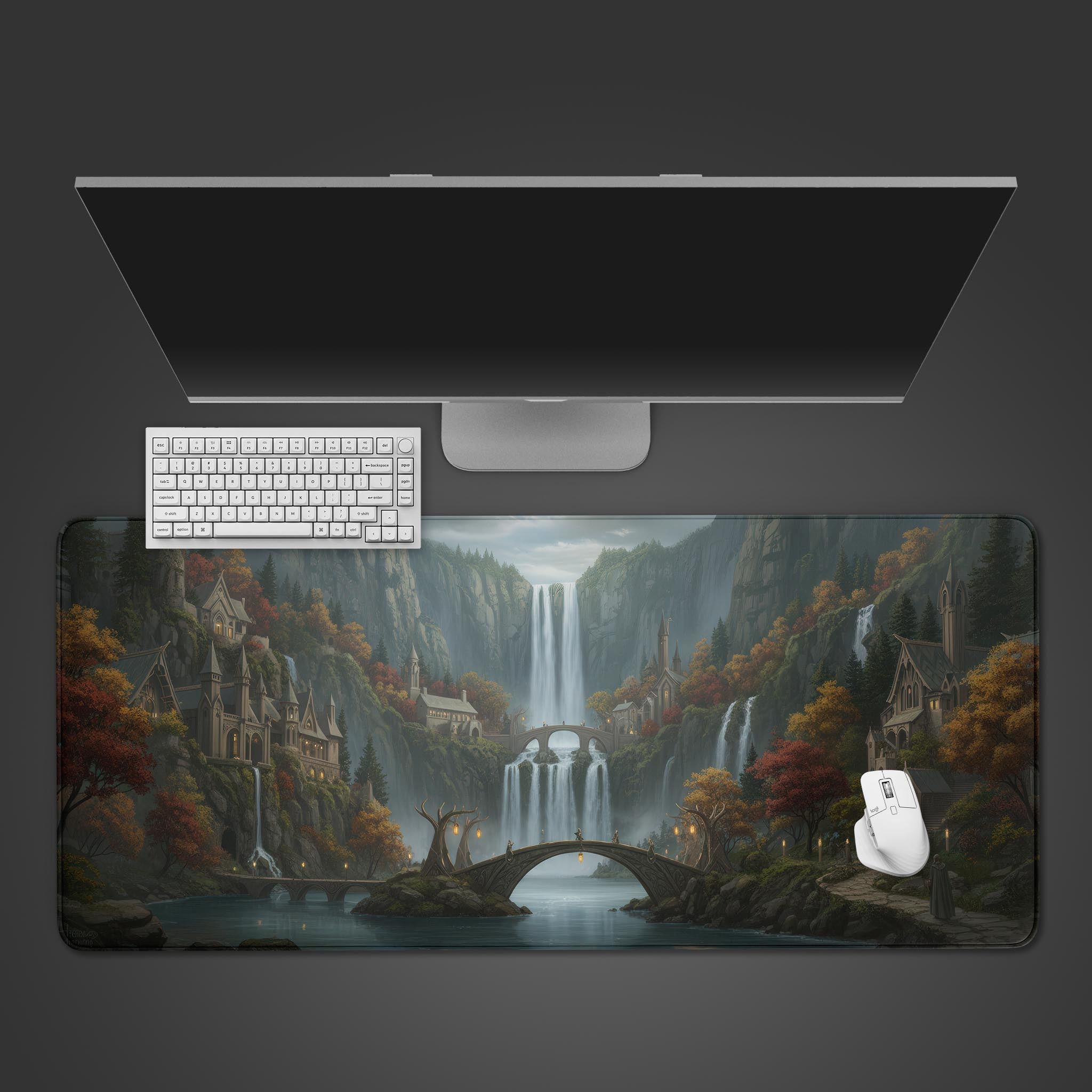 Elven Falls fantasy desk mat showing a waterfall city, viewed from above on a desk with a white keyboard and mouse. - Epic Design Pads