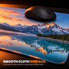 Custom desk mat close-up: a mouse on the smooth printed cloth surface, stitched edge
