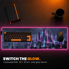 L Extended RGB Custom Desk Pad - example: edge lit pink, with art of a neon city at night