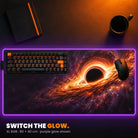 XL RGB Custom Desk Pad - example: edge lit purple, with space art of a black hole